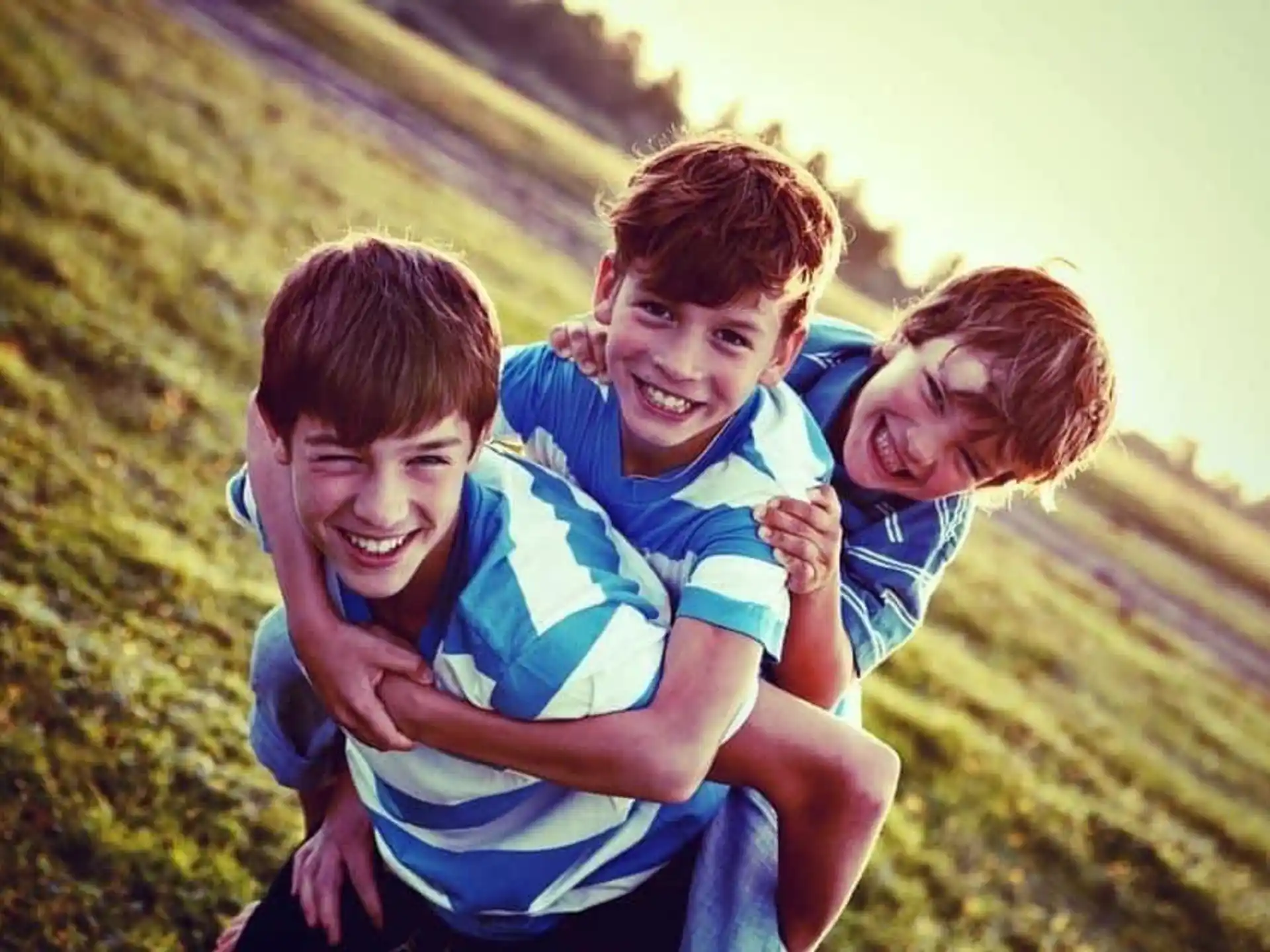 a group of boys hugging