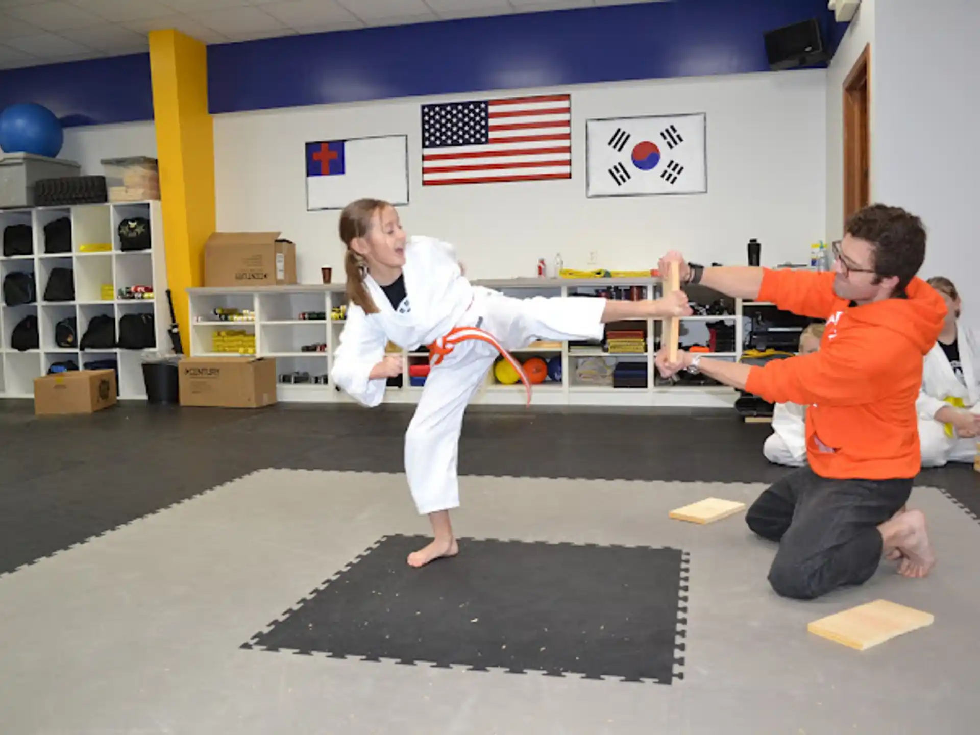 a man and a woman in a karate uniform