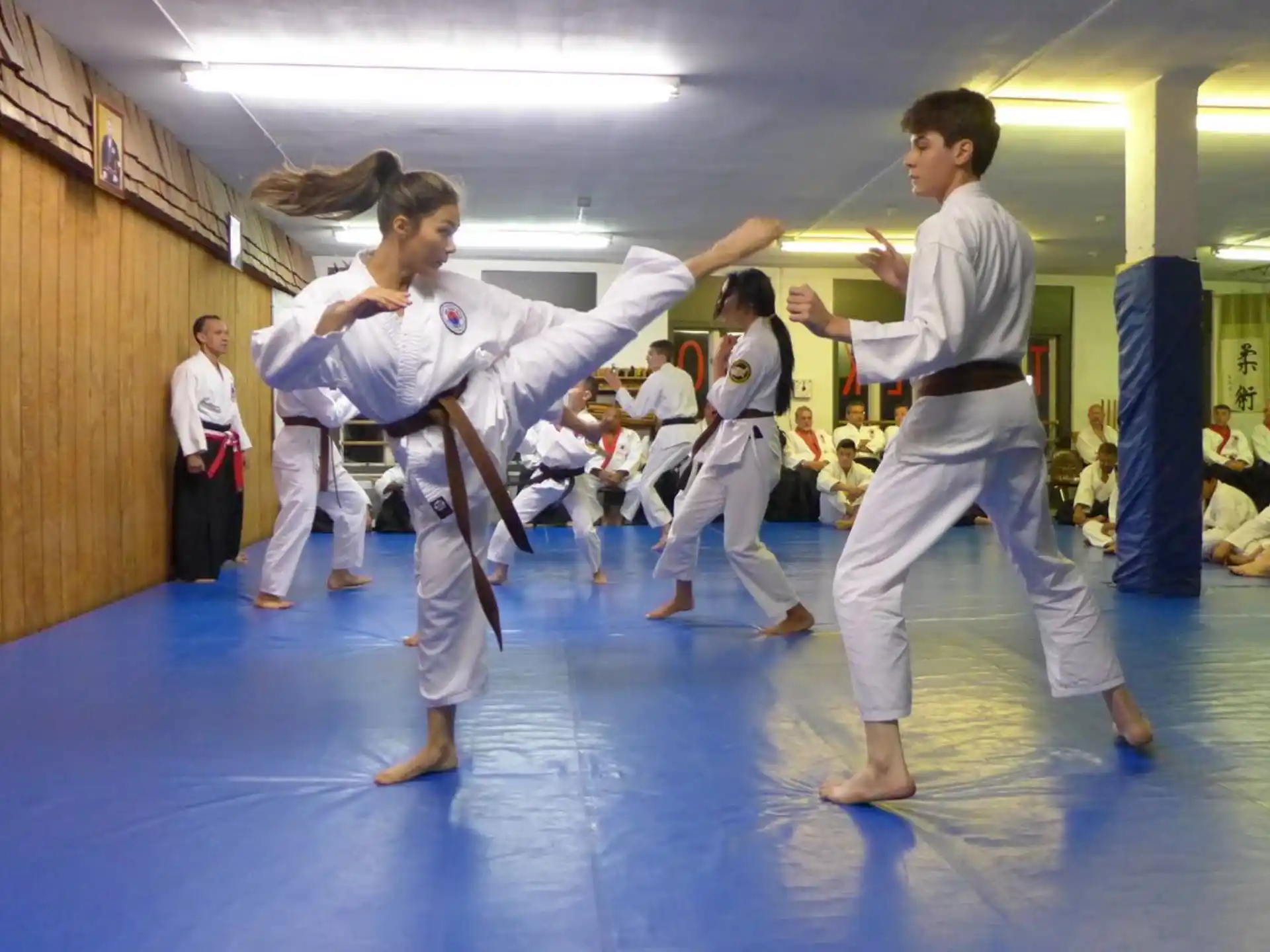a group of people in karate uniforms