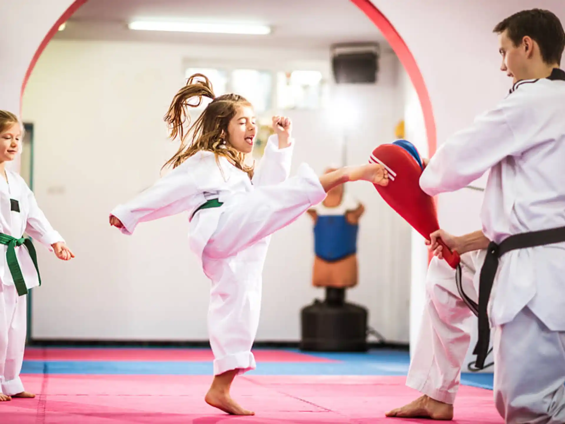 a group of people in karate uniforms