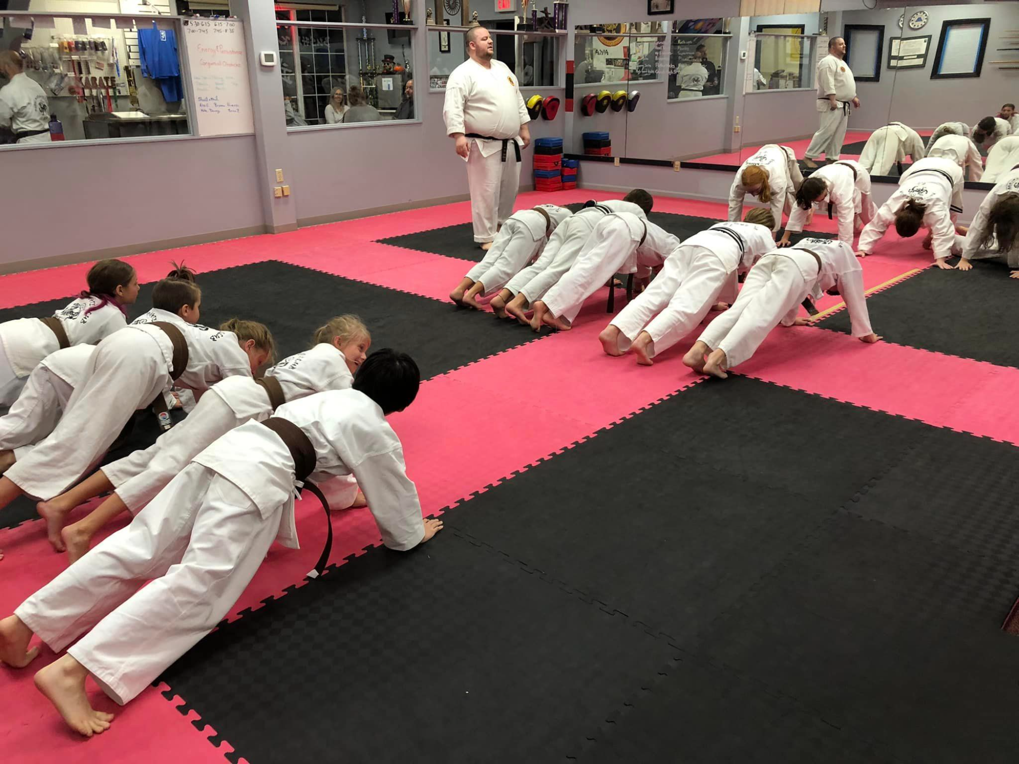 a group of people in karate uniforms