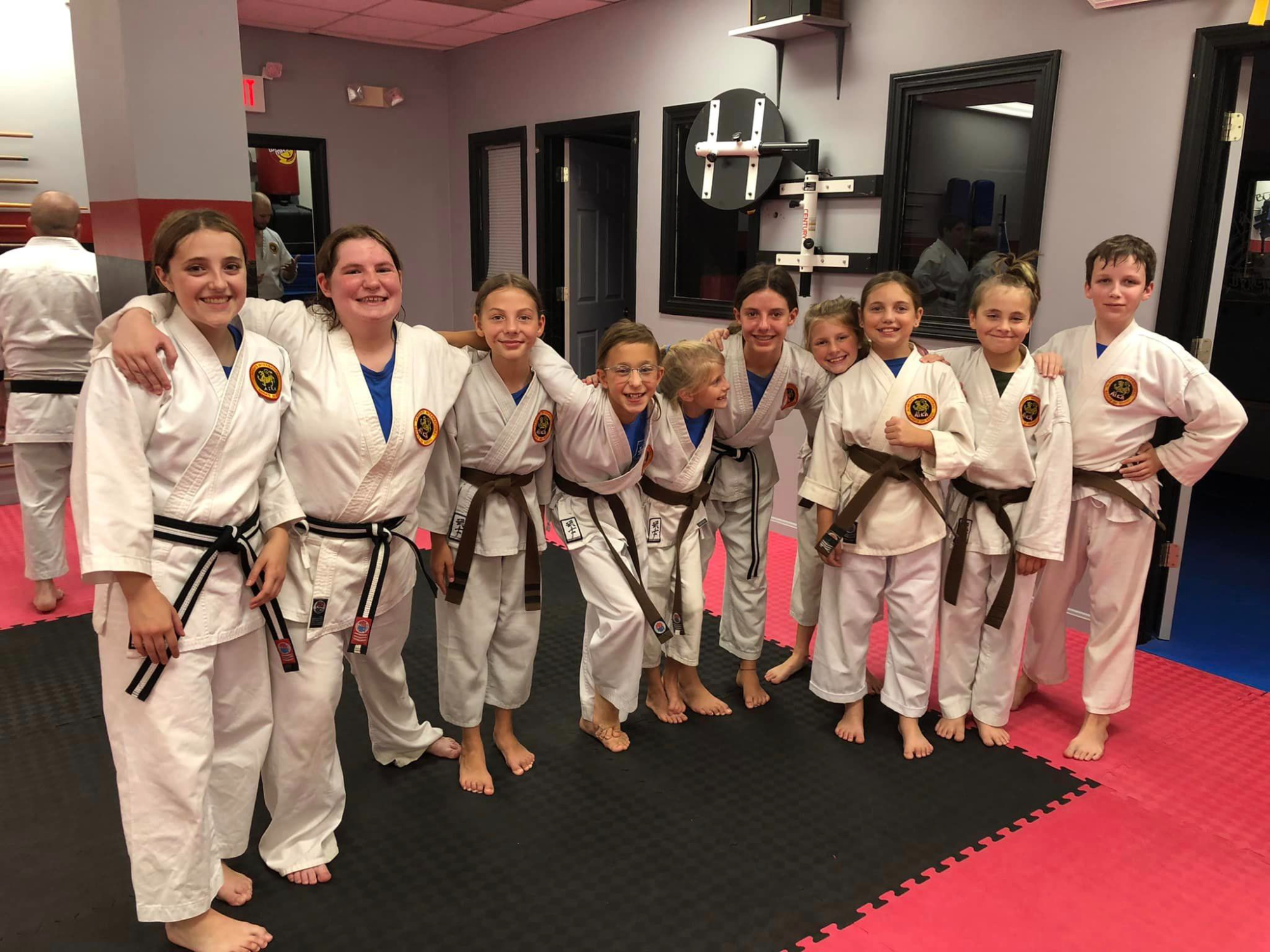 a group of people in karate uniforms