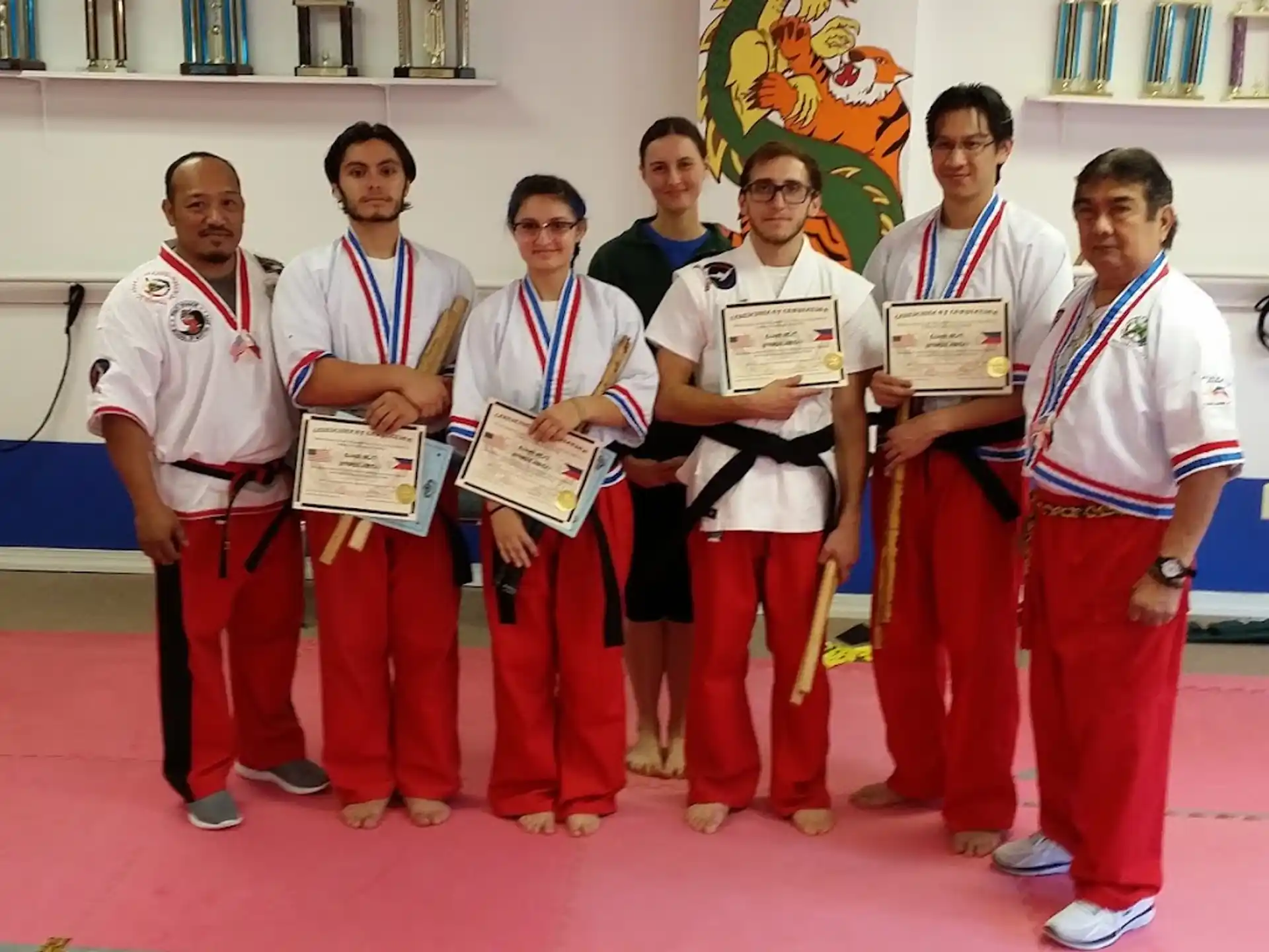 a group of people wearing medals
