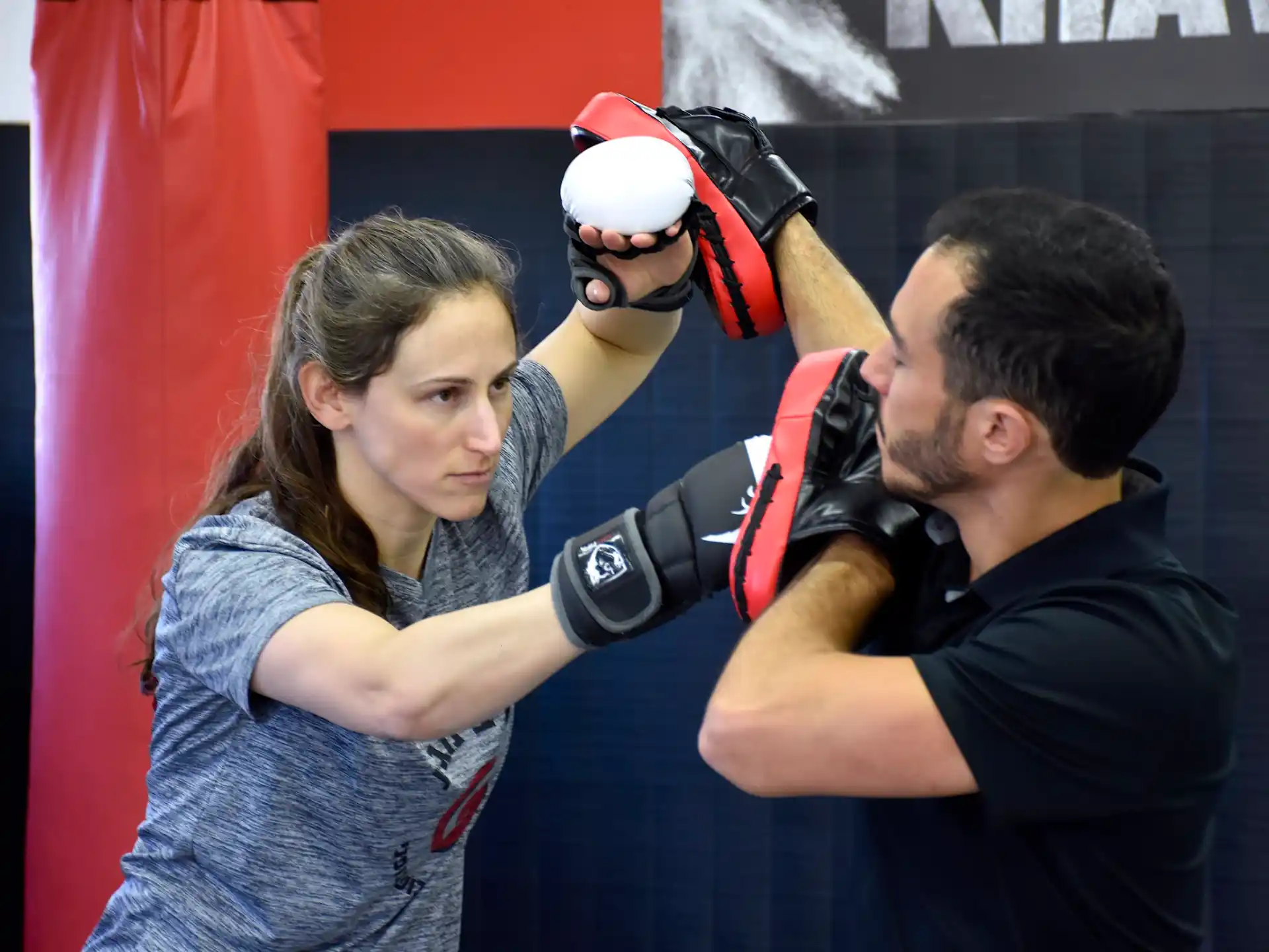 a man punching a woman