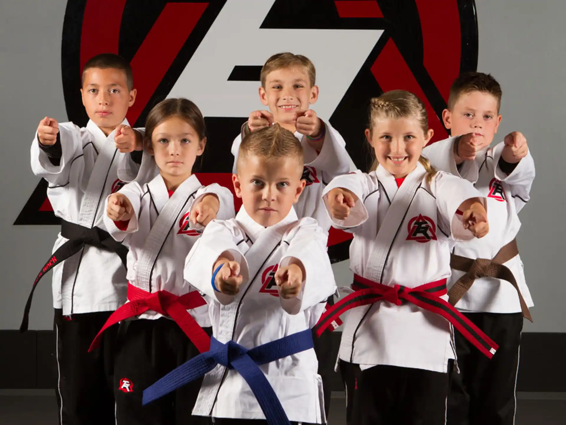 a group of boys in karate uniforms