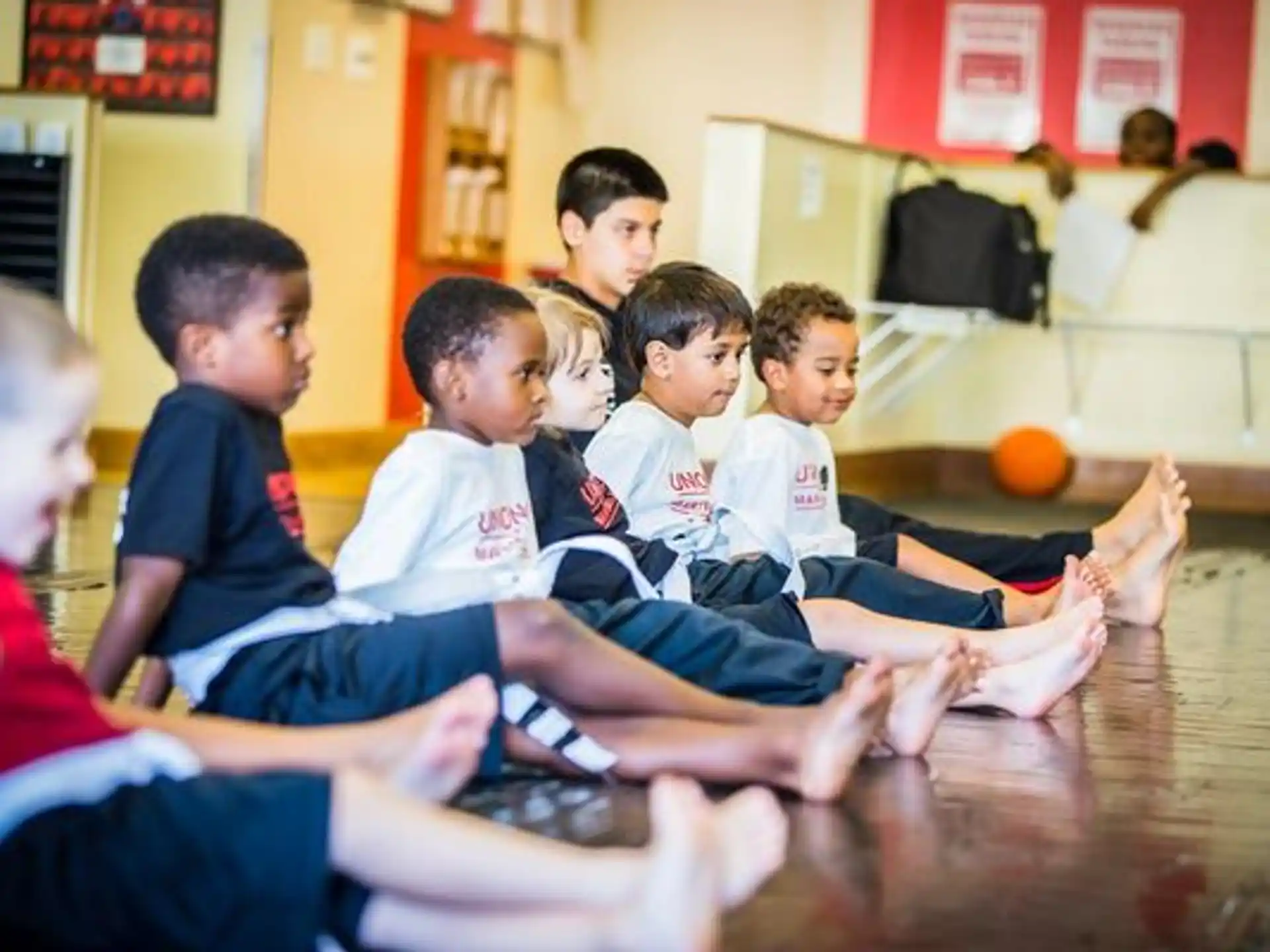 a group of boys sitting on the floor