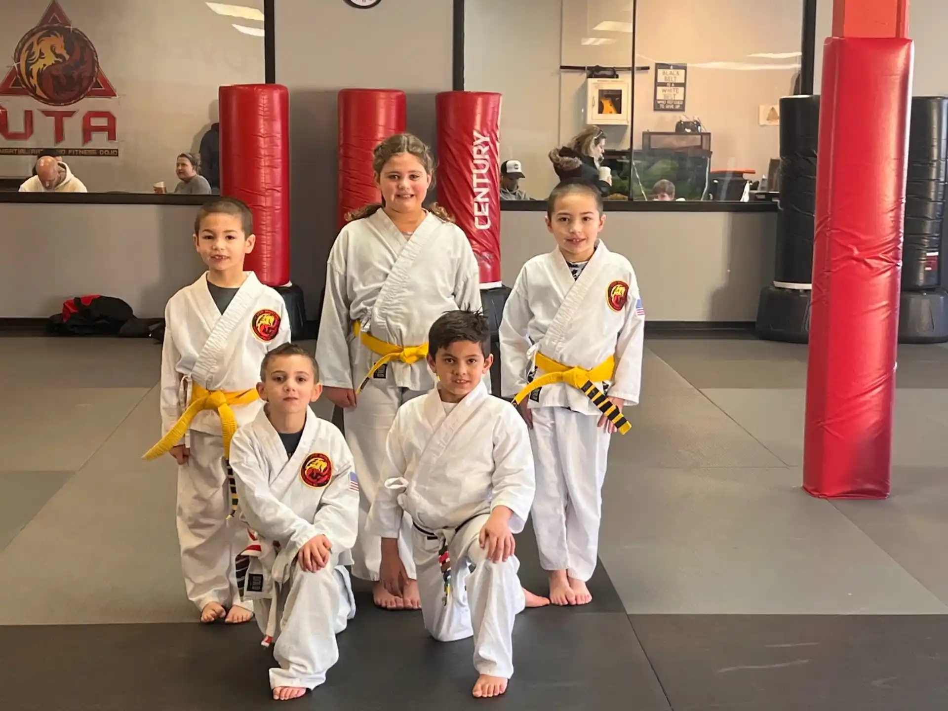 a group of people in karate uniforms