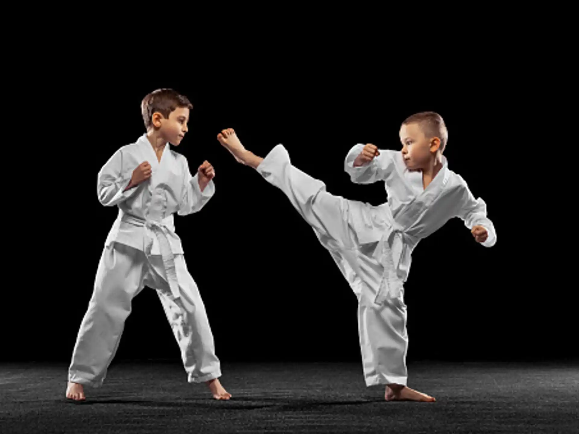 two boys in karate uniforms