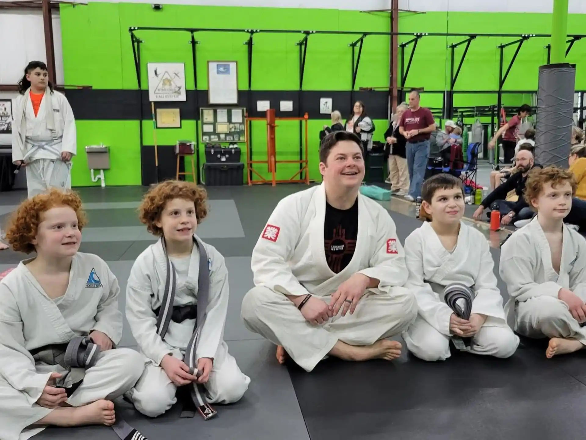 a group of people sitting on the floor