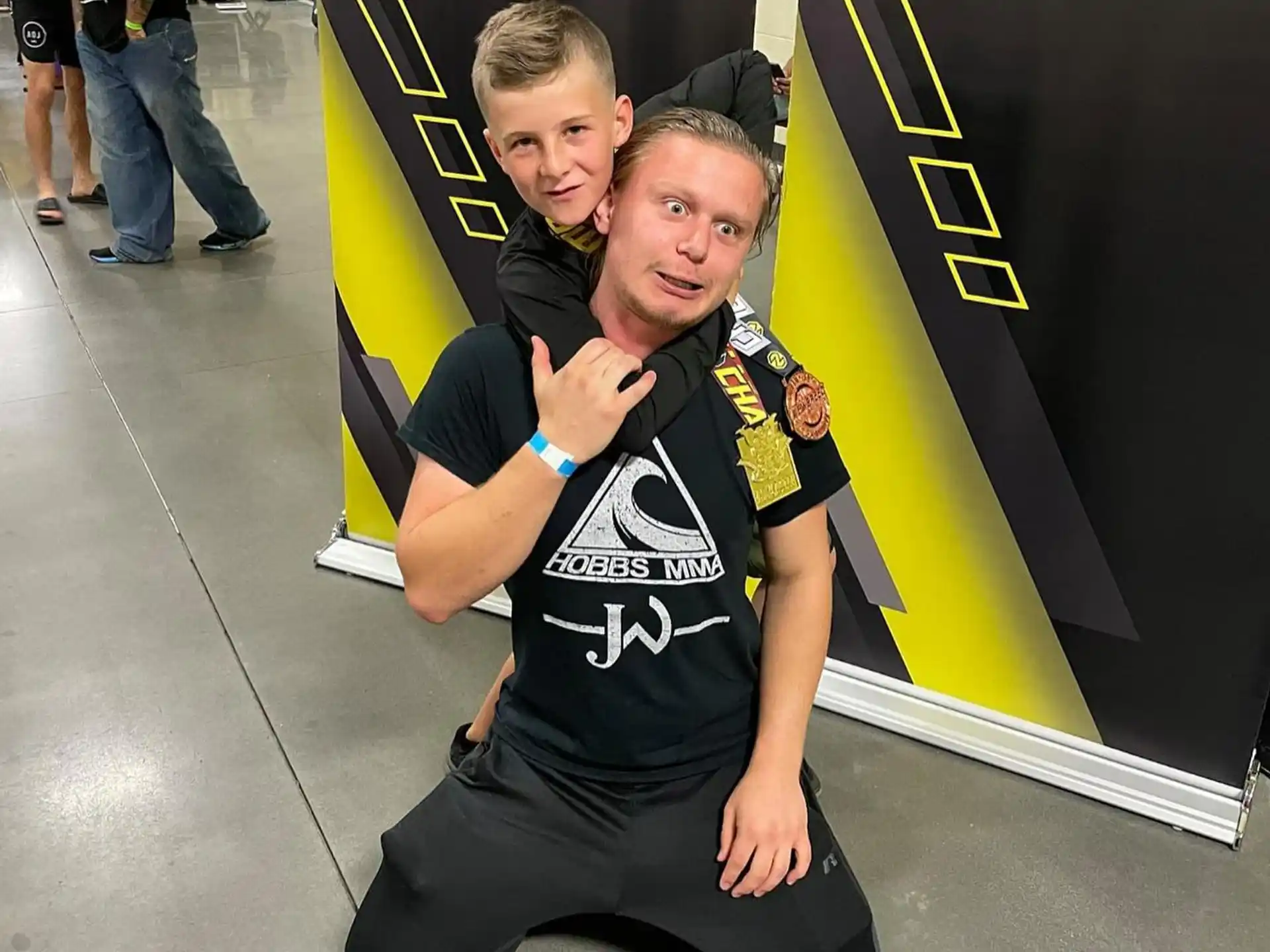 a person holding a boy