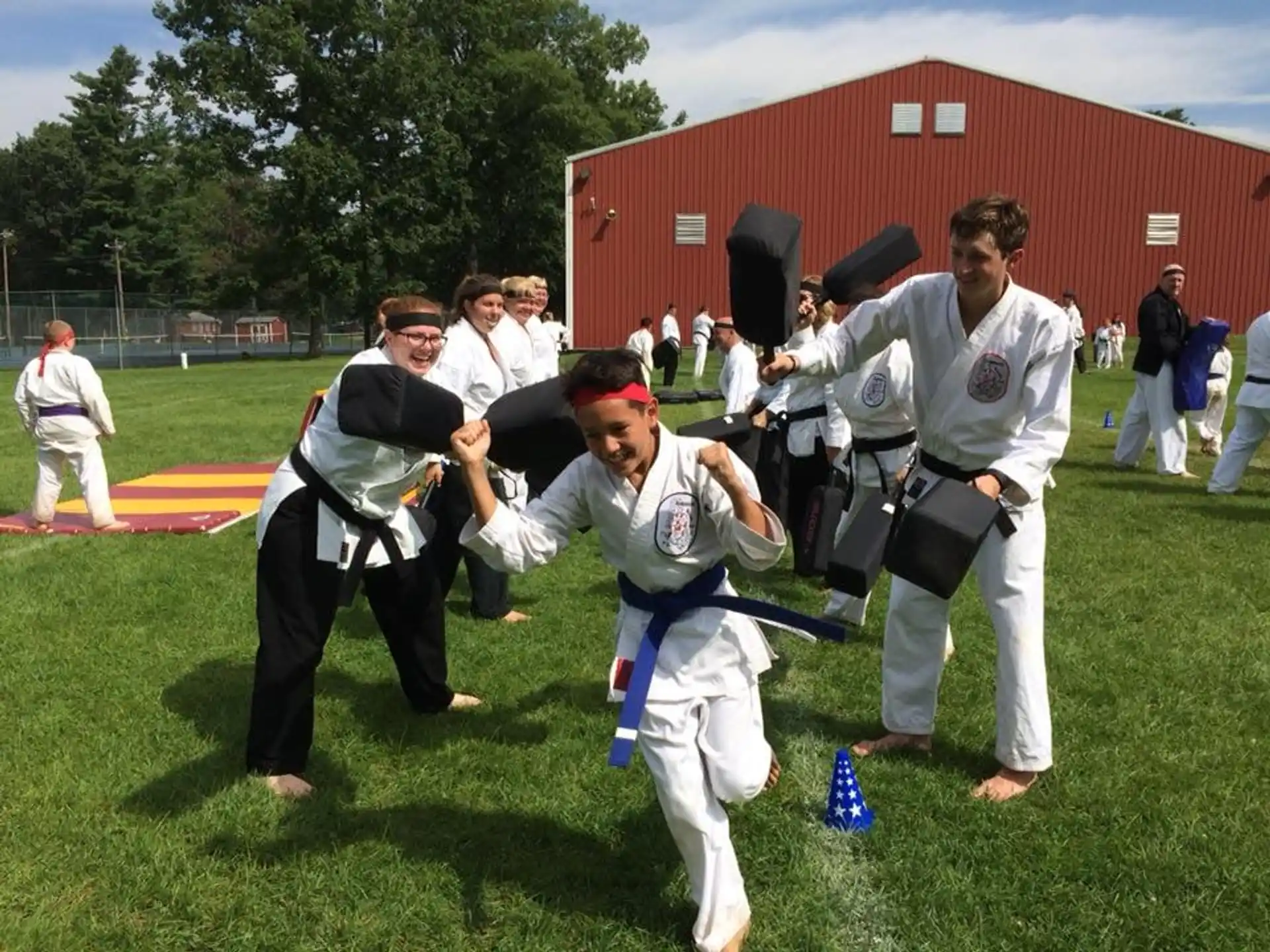 a group of people in karate uniforms