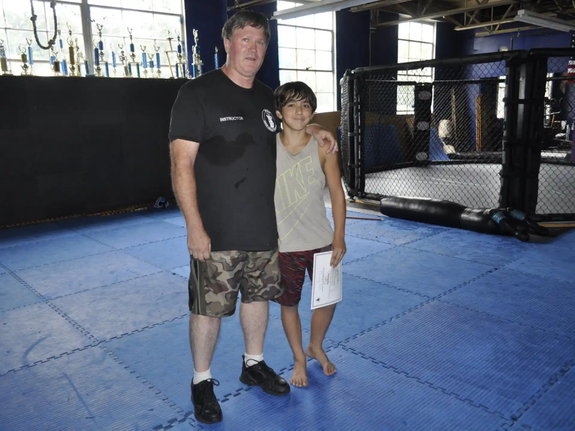 a person and a boy posing for a picture
