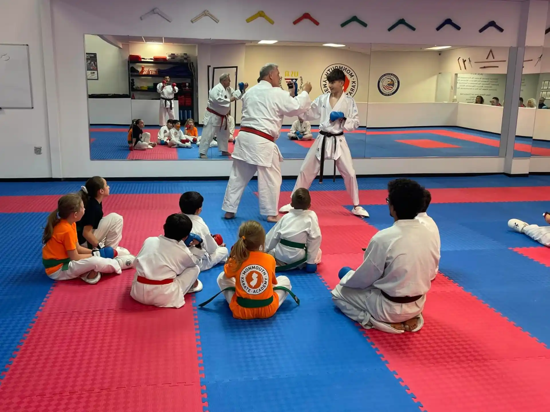 a group of people in a karate class