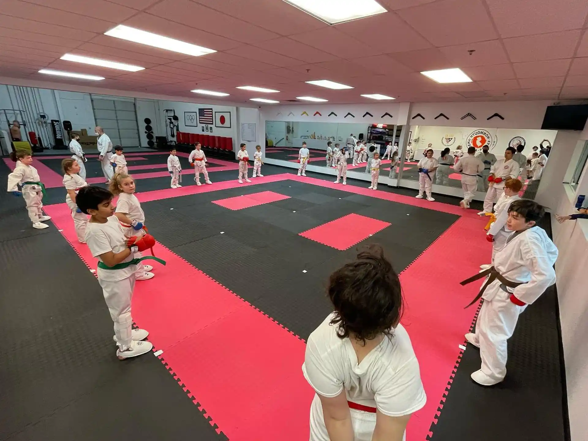 a group of people in karate uniforms