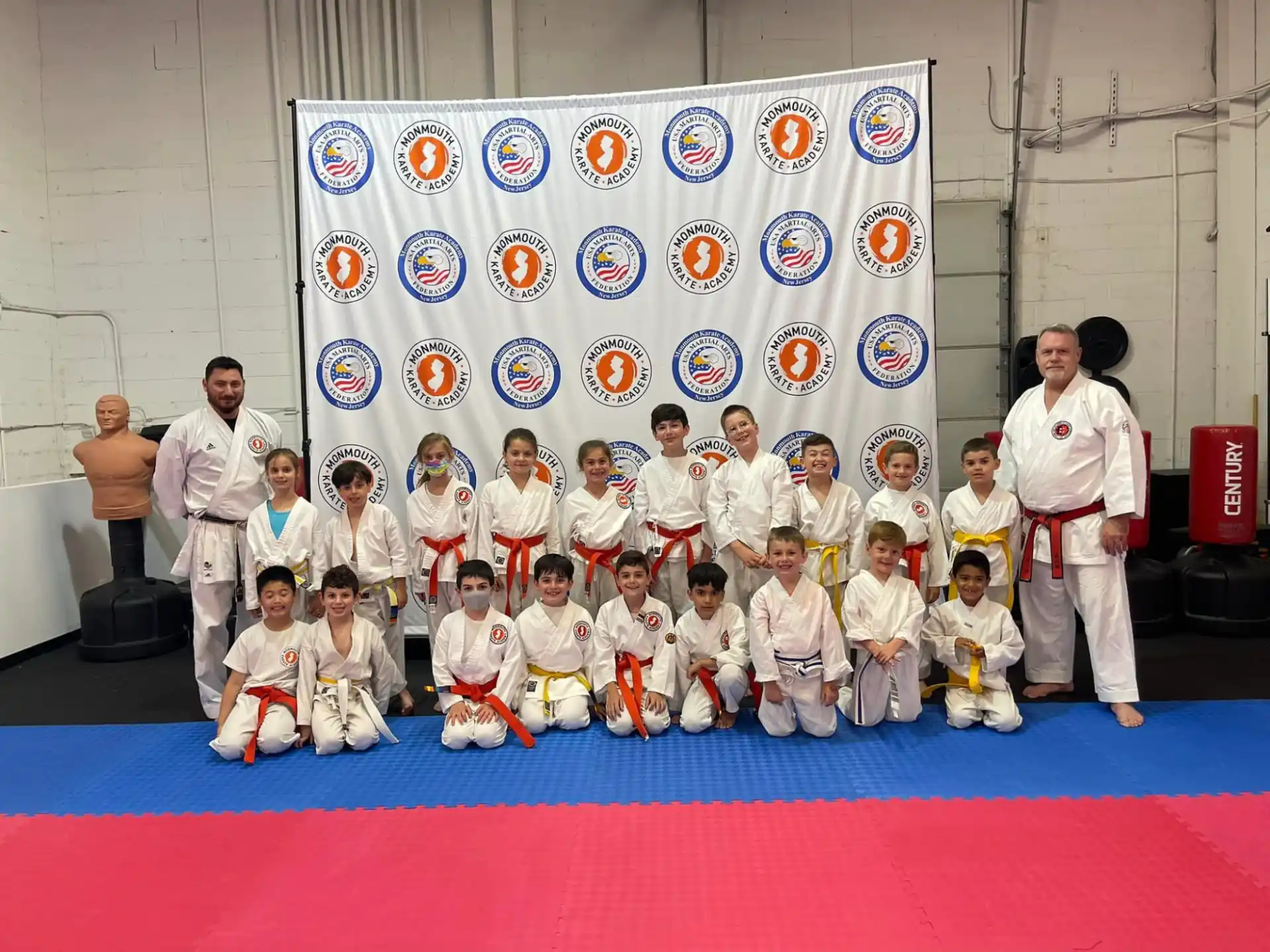 a group of people in karate uniforms