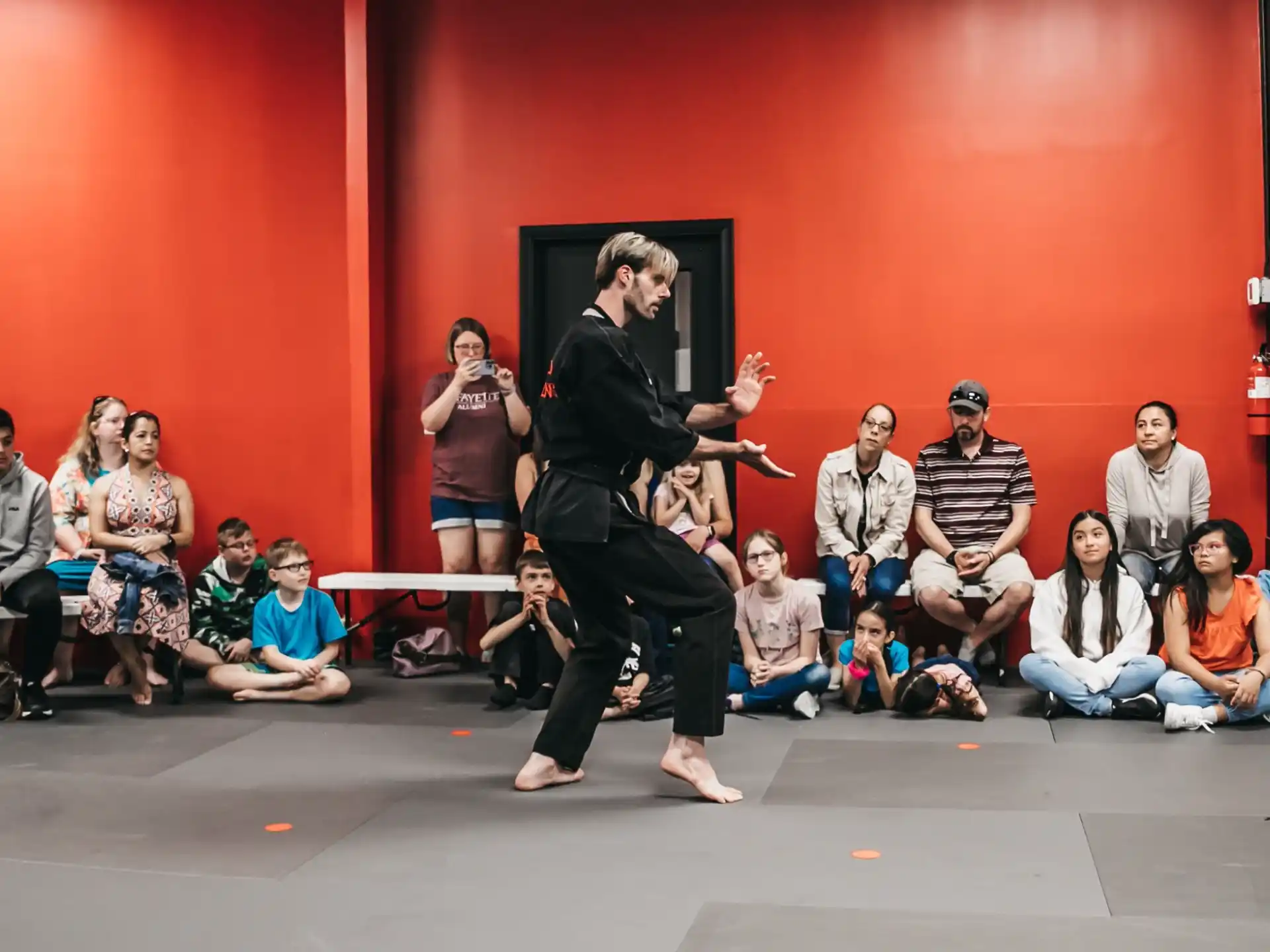 a person dancing in front of a group of people
