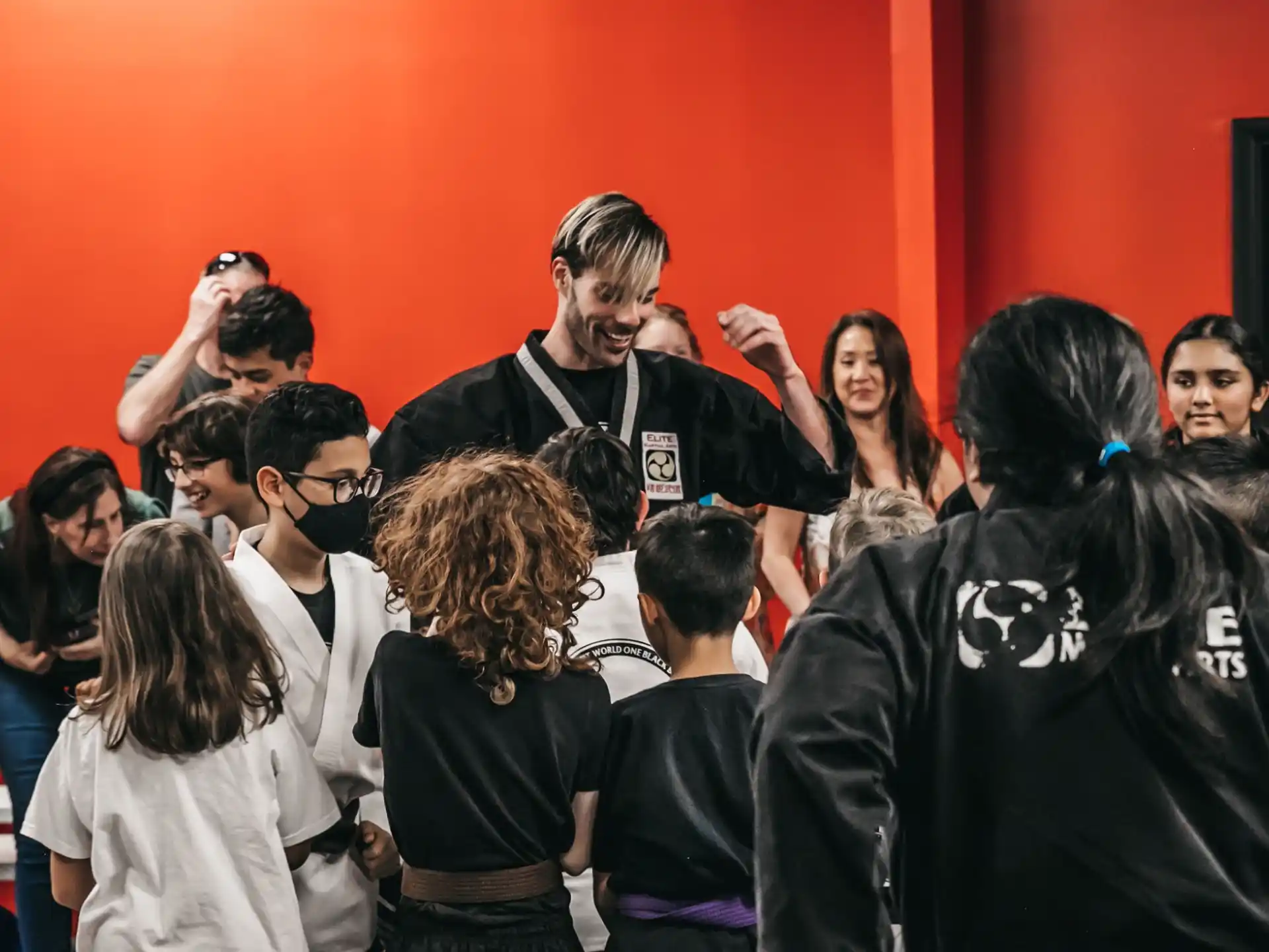 a person with a microphone in front of a group of people