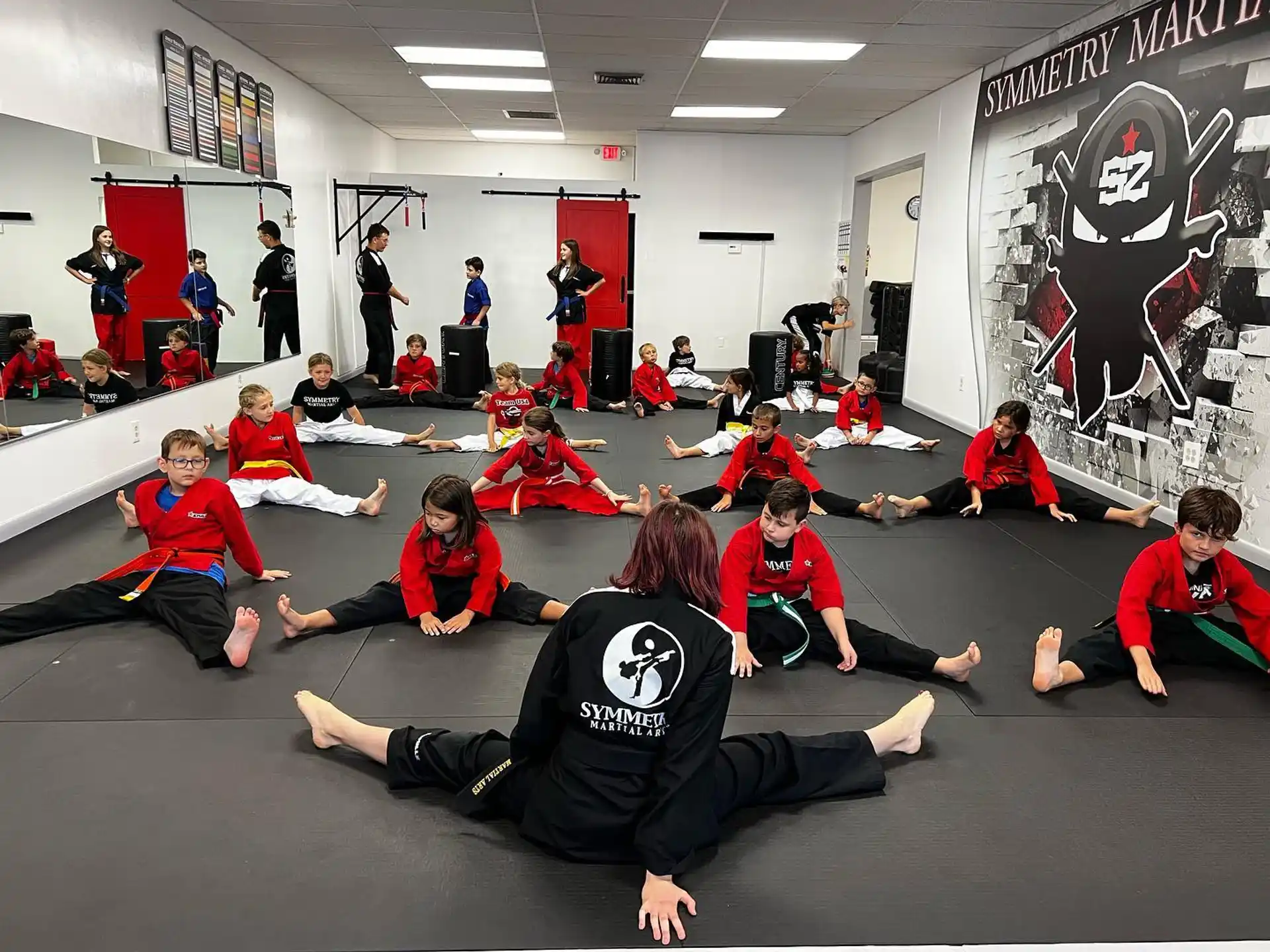 a group of people sitting on the floor in a room