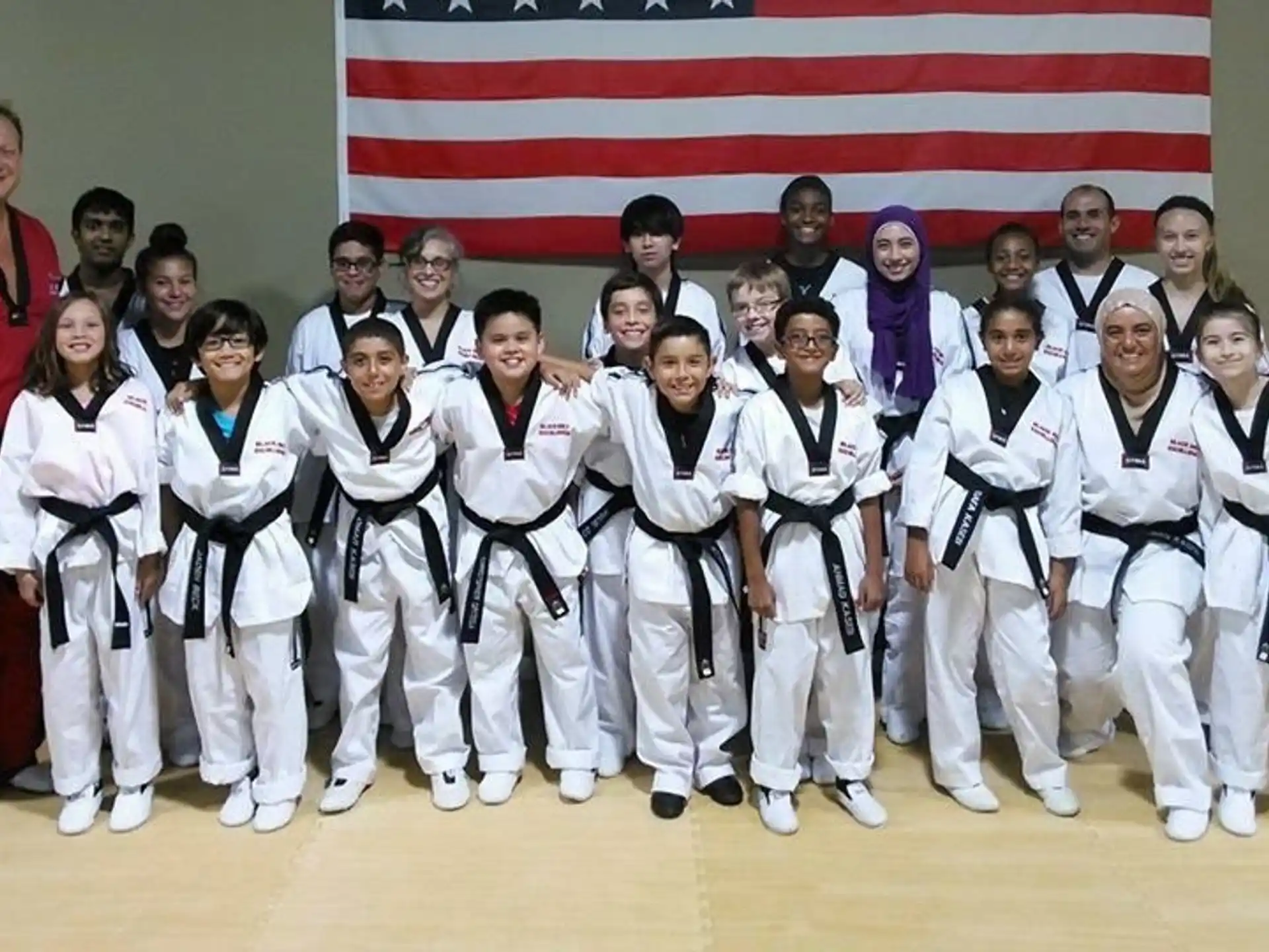 a group of people in karate uniforms