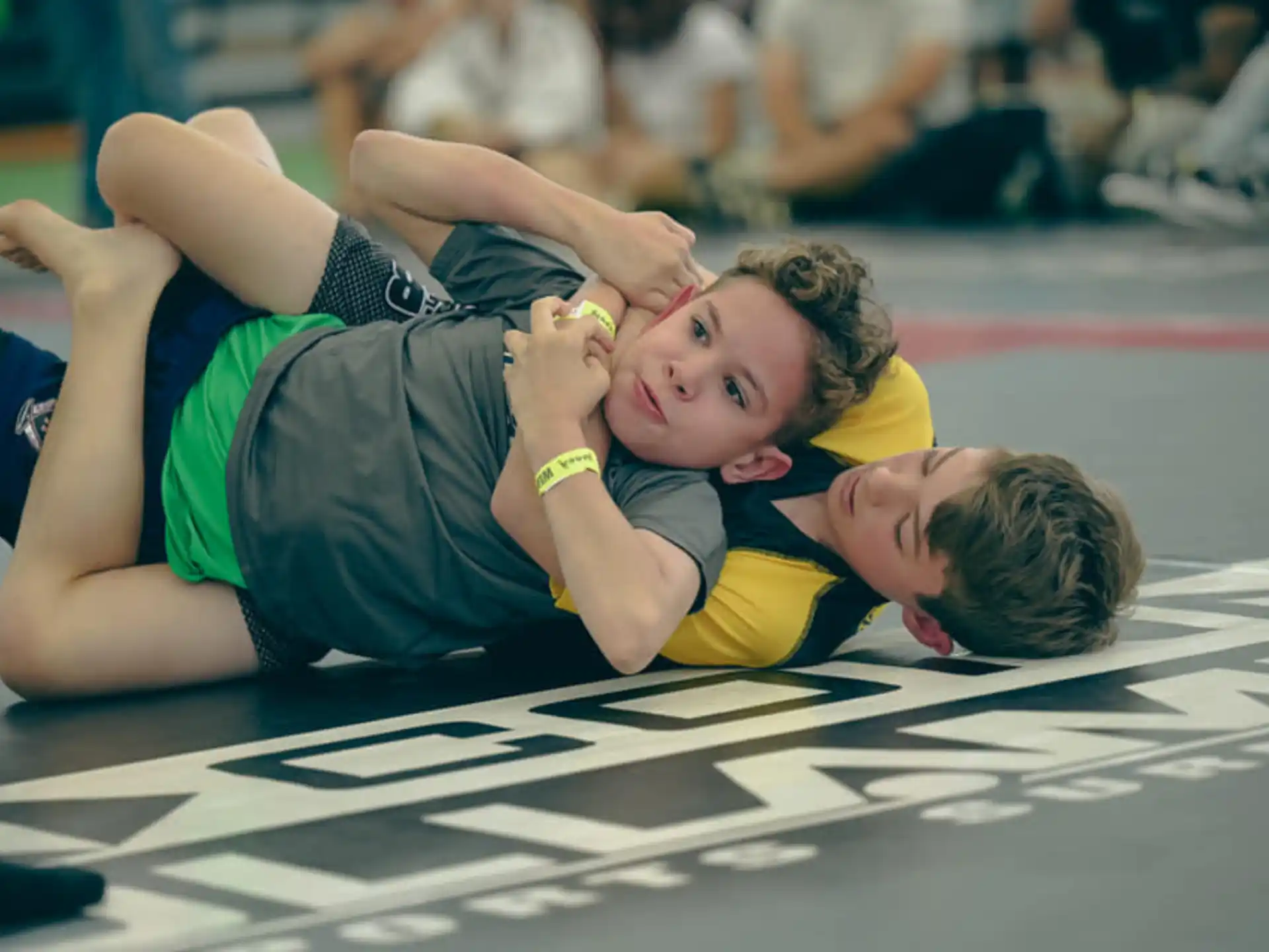 a couple of boys lying on the floor