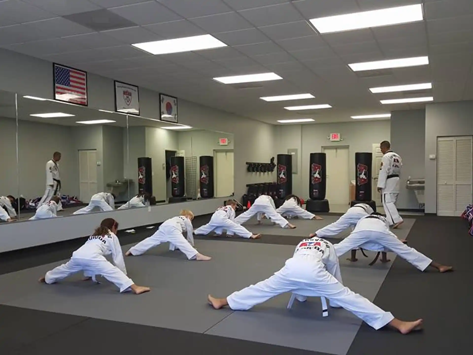 a group of people in karate uniforms