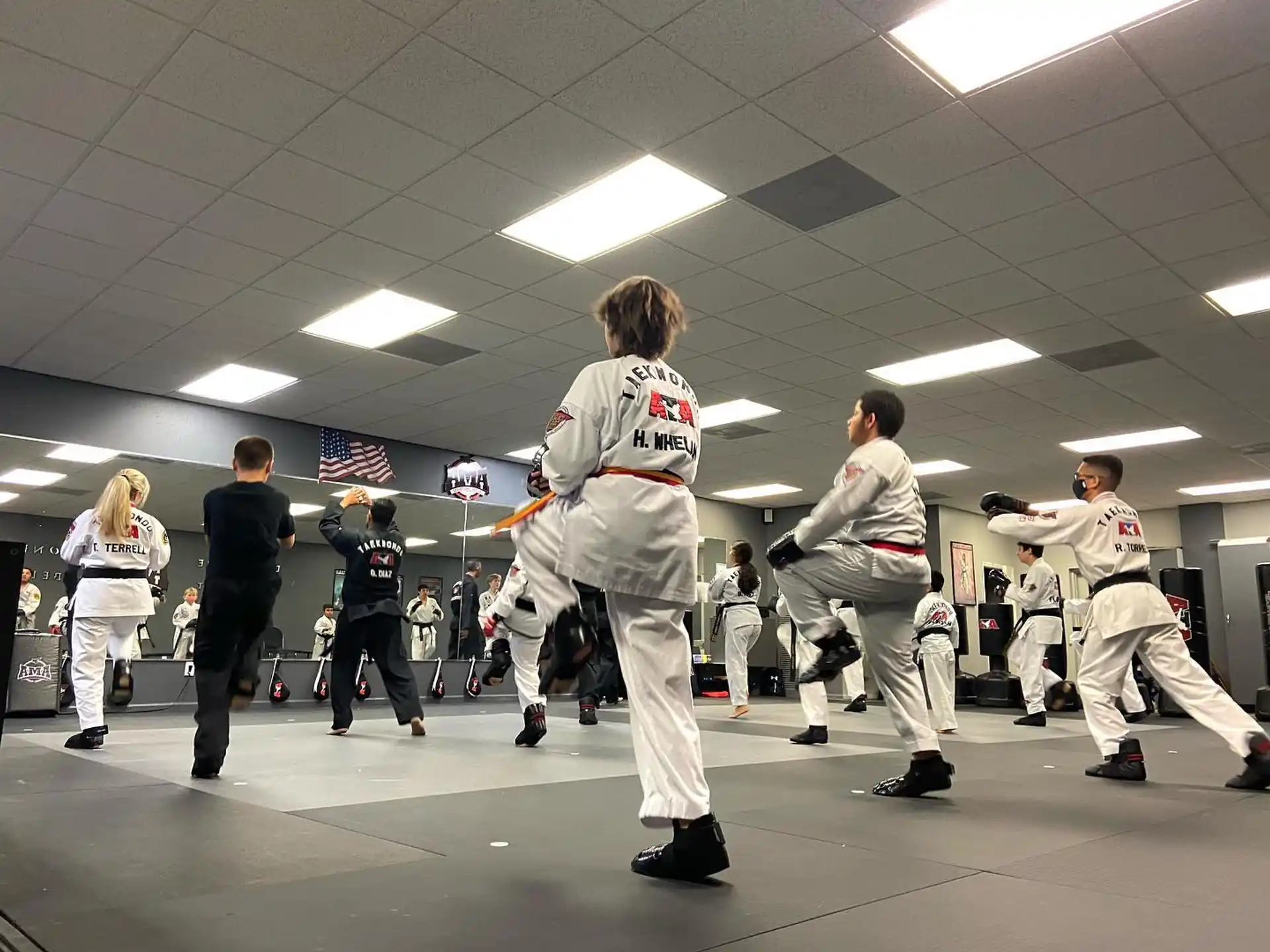 a group of people in karate uniforms