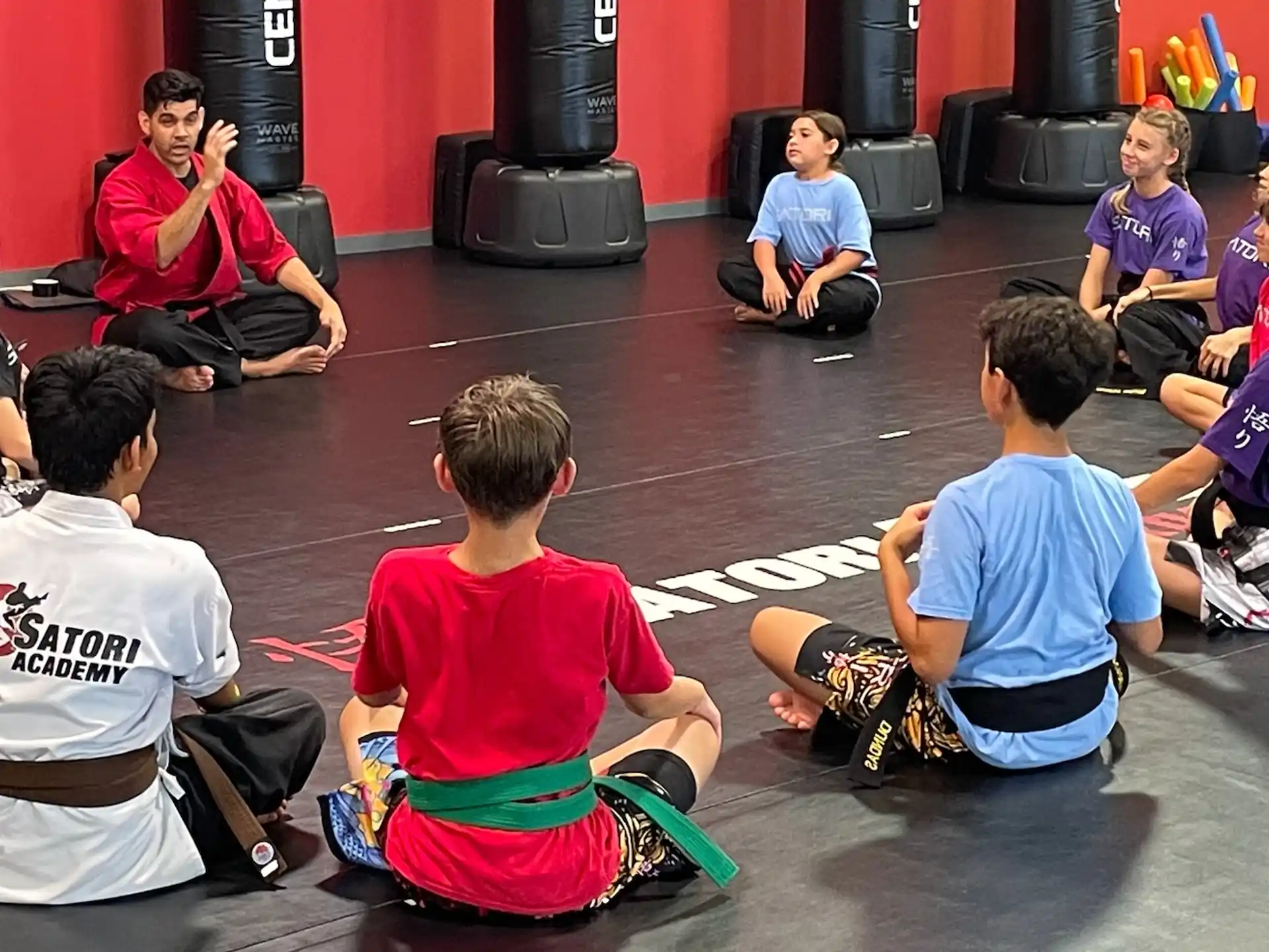 a group of kids sitting on the floor