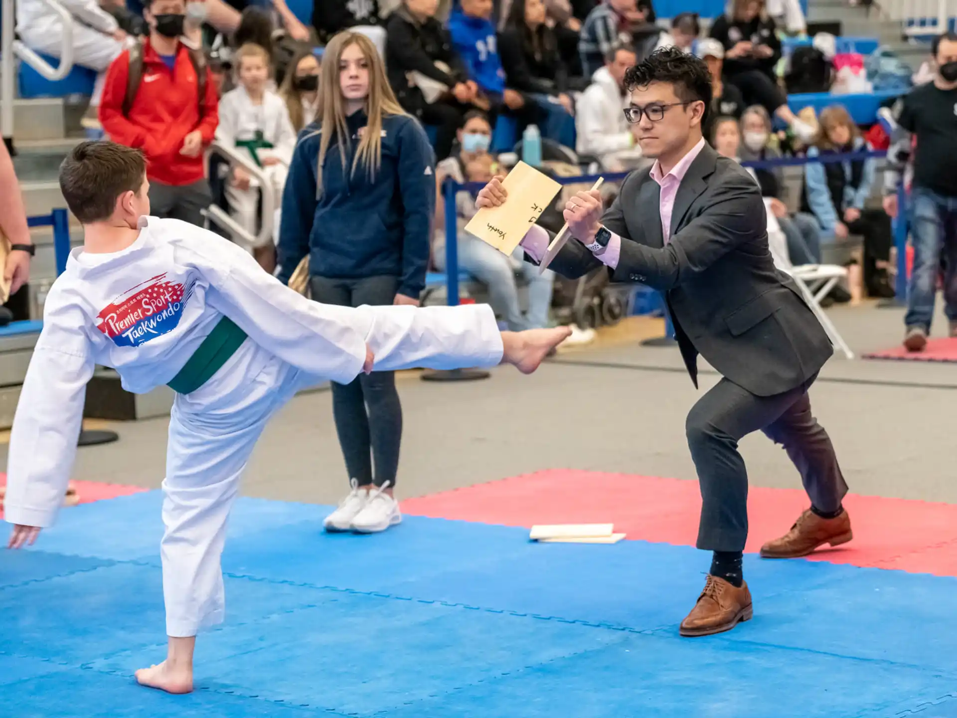 a man and a woman in karate uniforms
