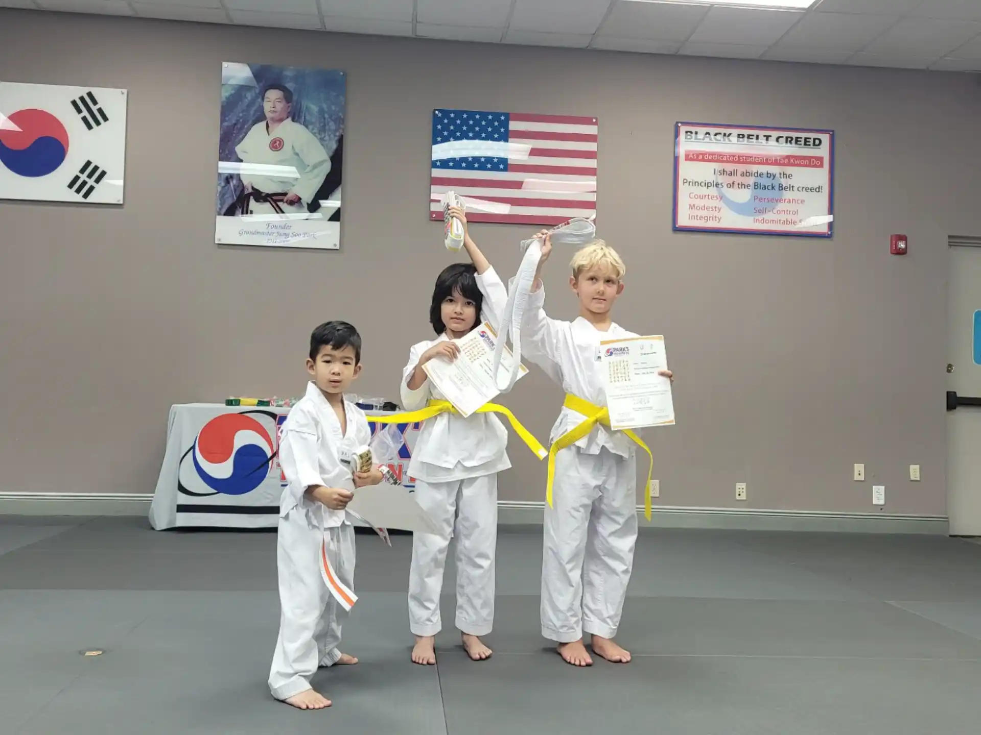 a group of people in karate uniforms