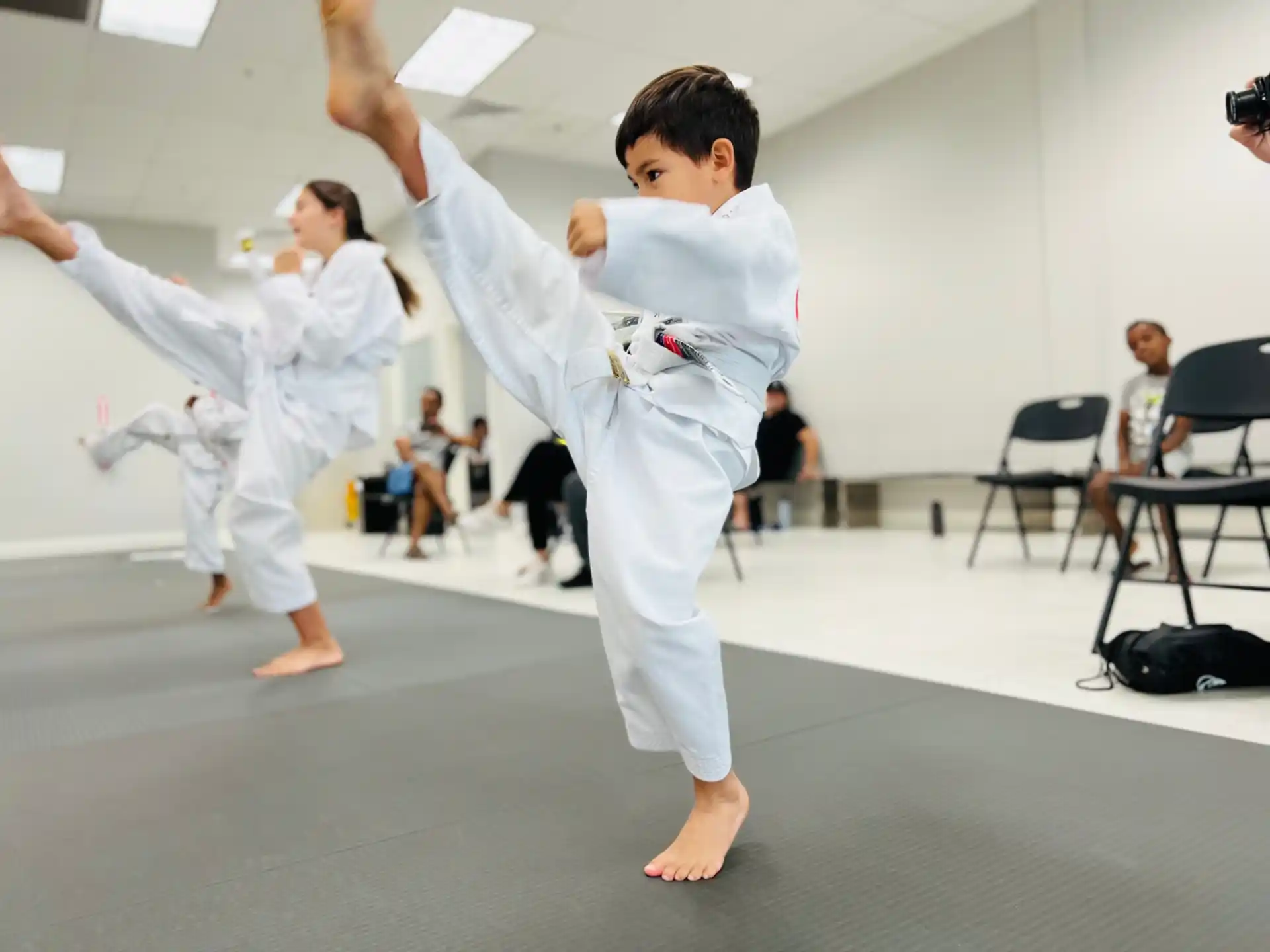 a group of people in karate uniforms