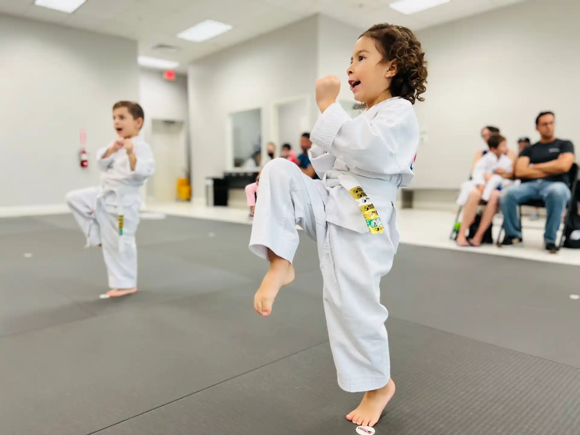 a young girl in a karate uniform