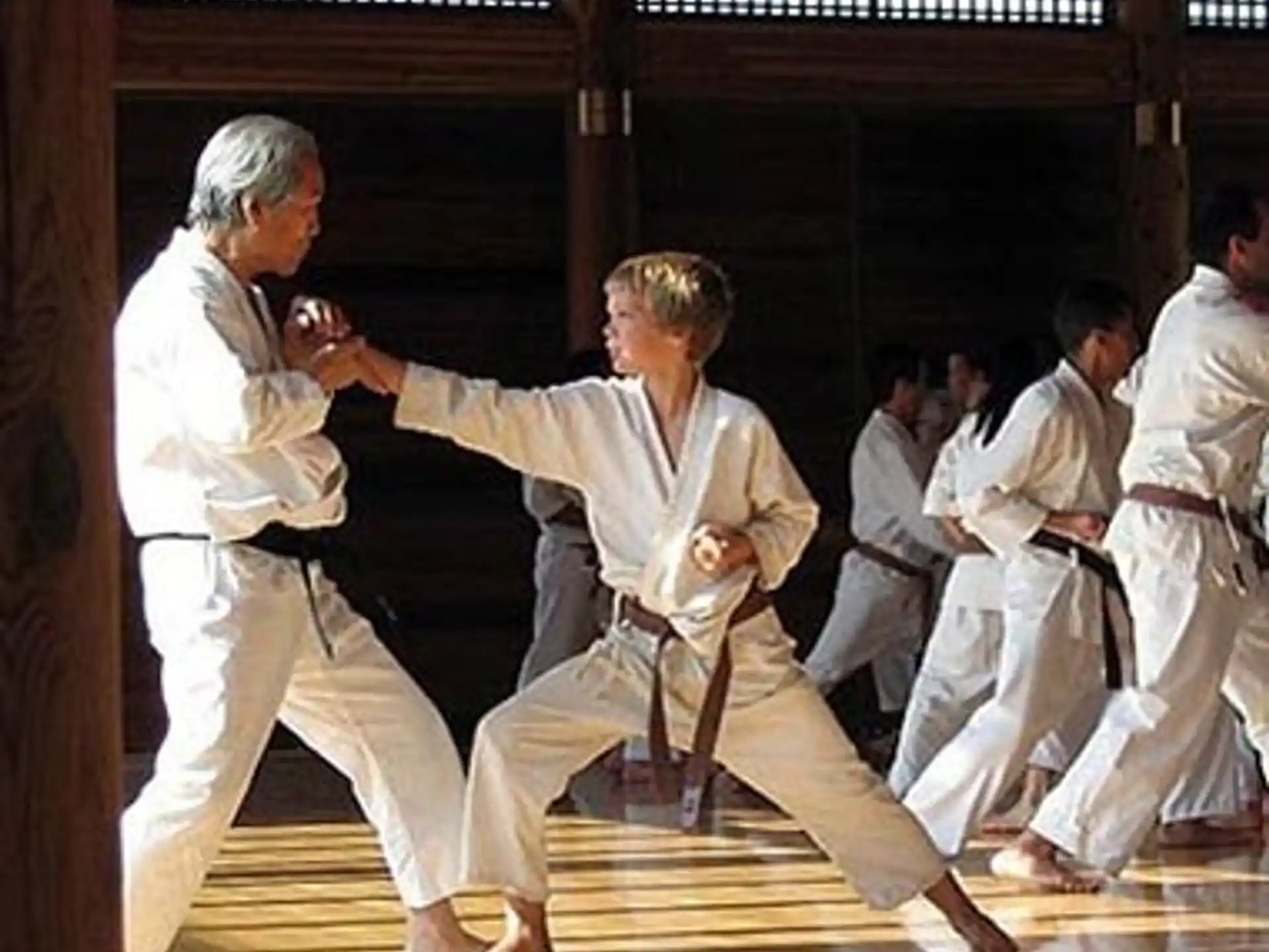 a group of men in karate uniforms