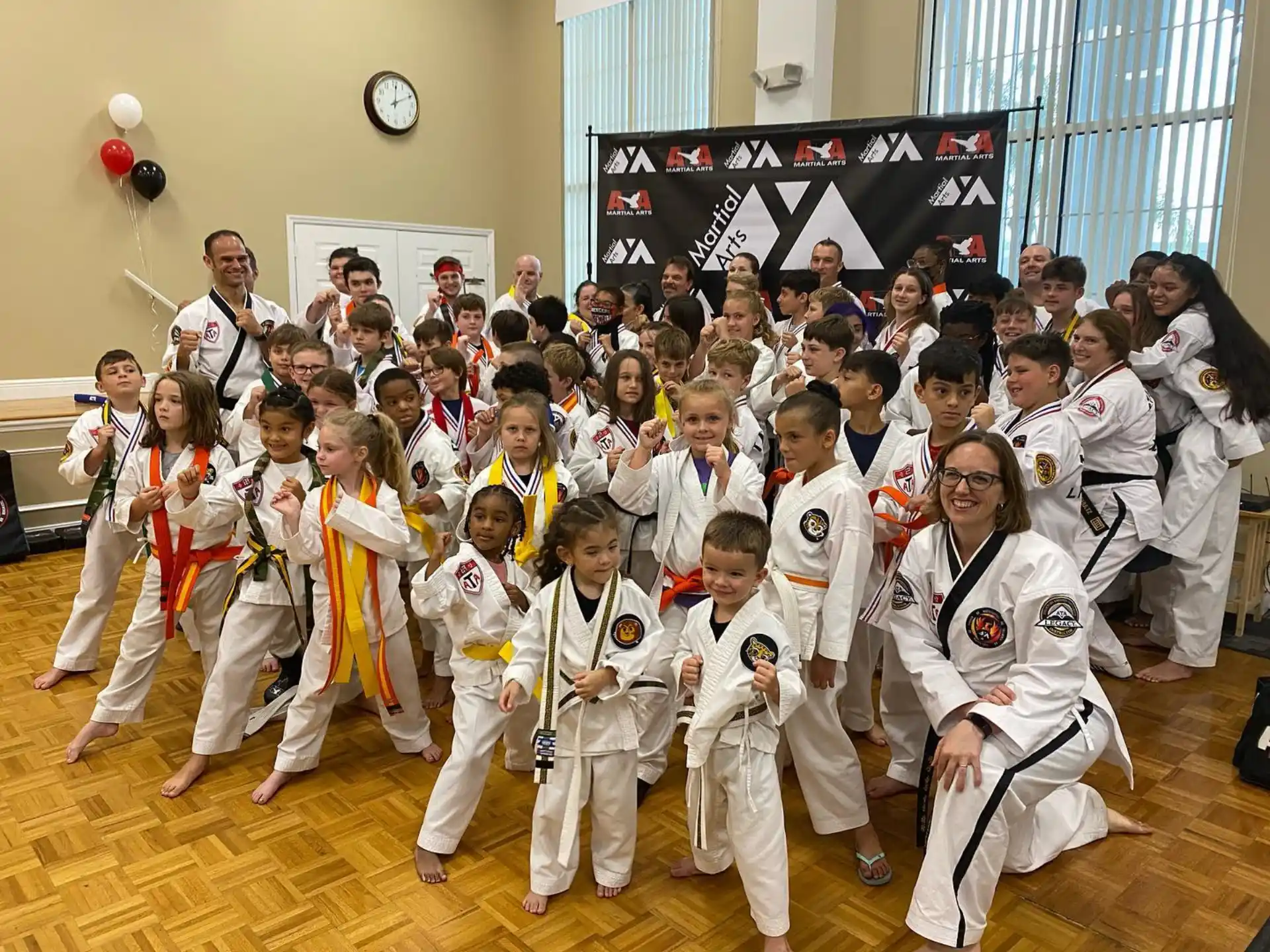 a group of people in karate uniforms