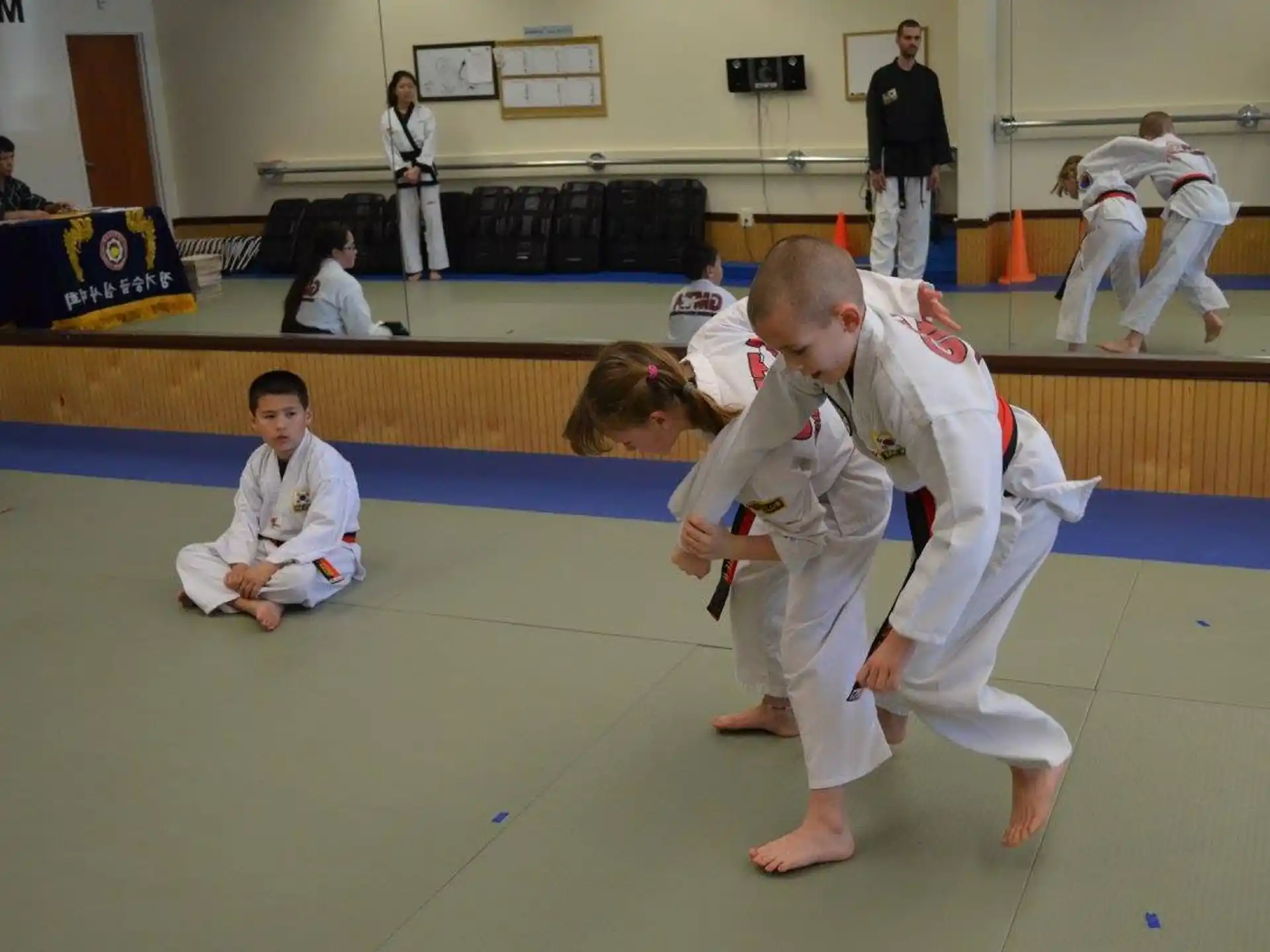 a group of people in karate uniforms