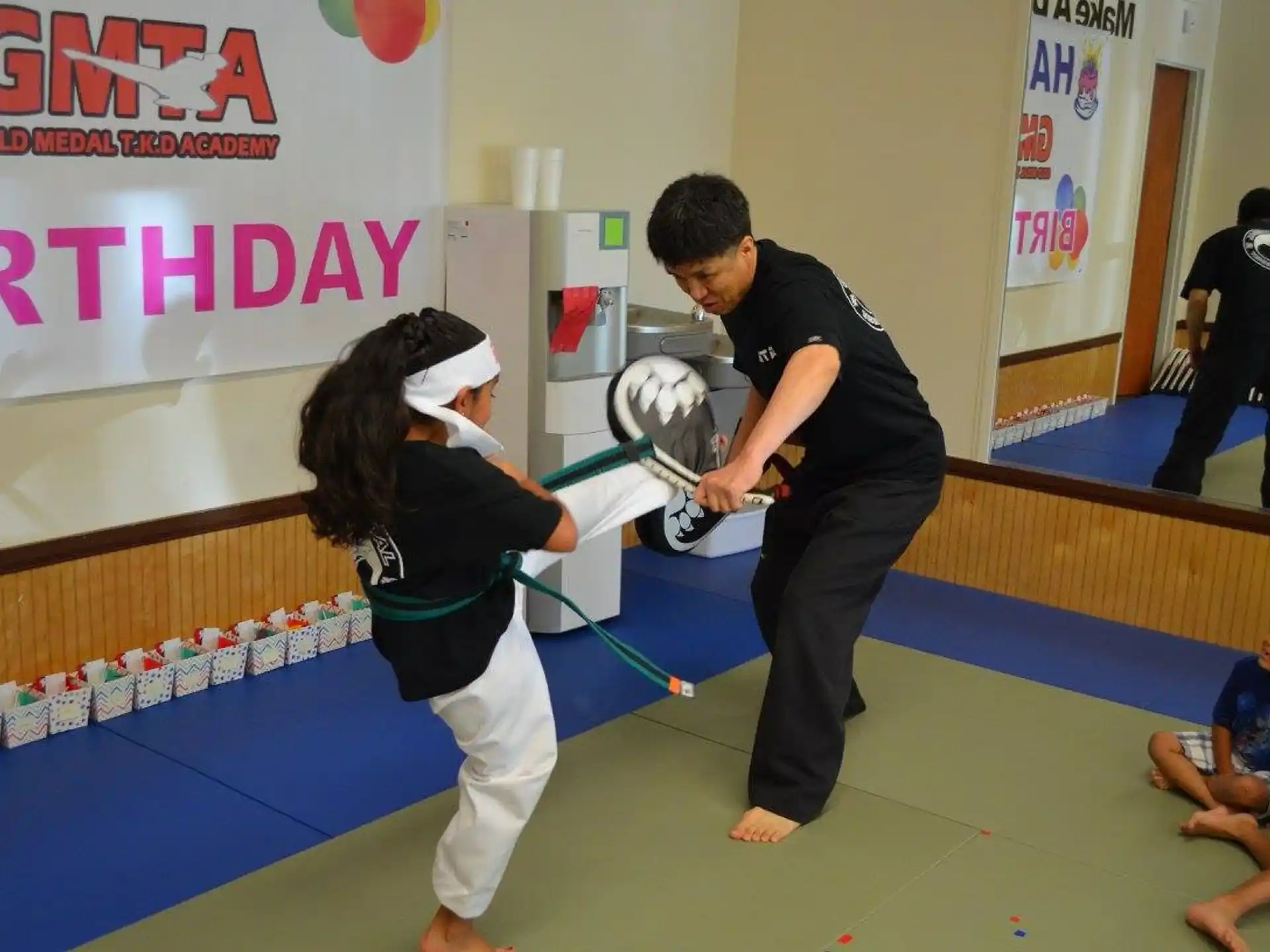 a man and a woman practicing martial arts