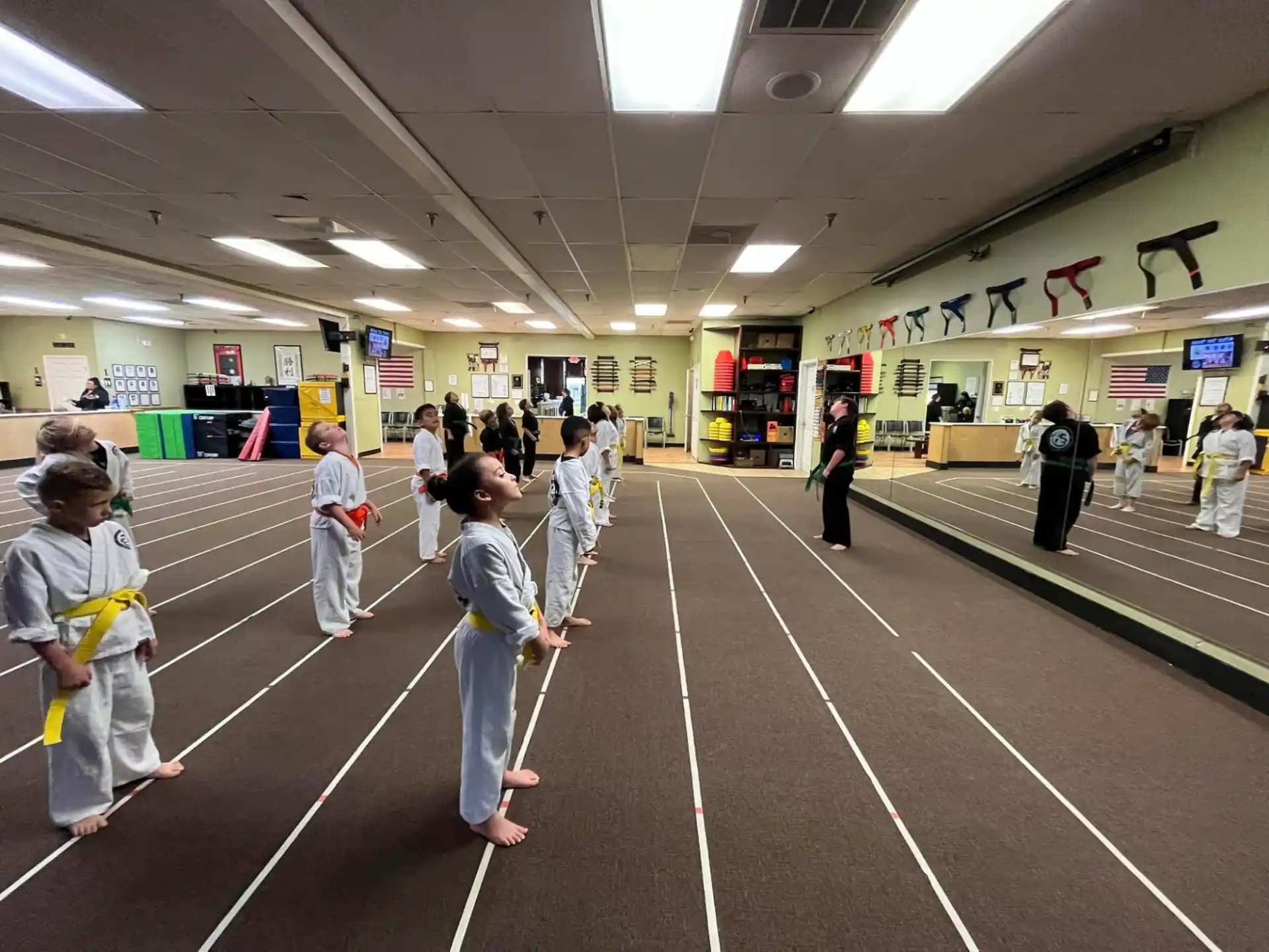 a group of people in a large room with a large floor