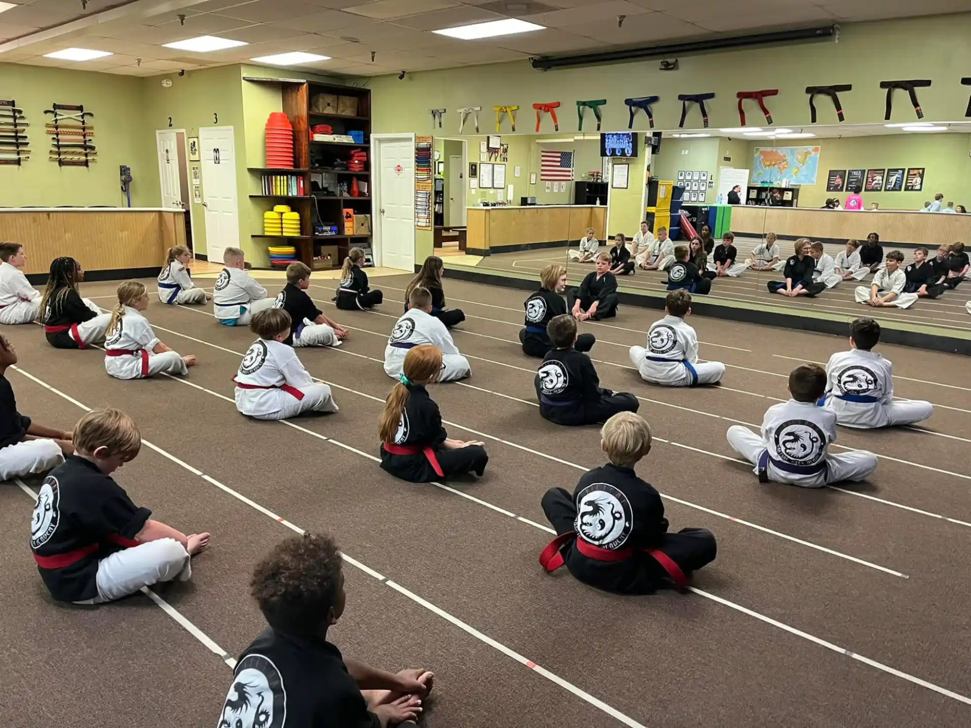 a group of people sitting on the floor