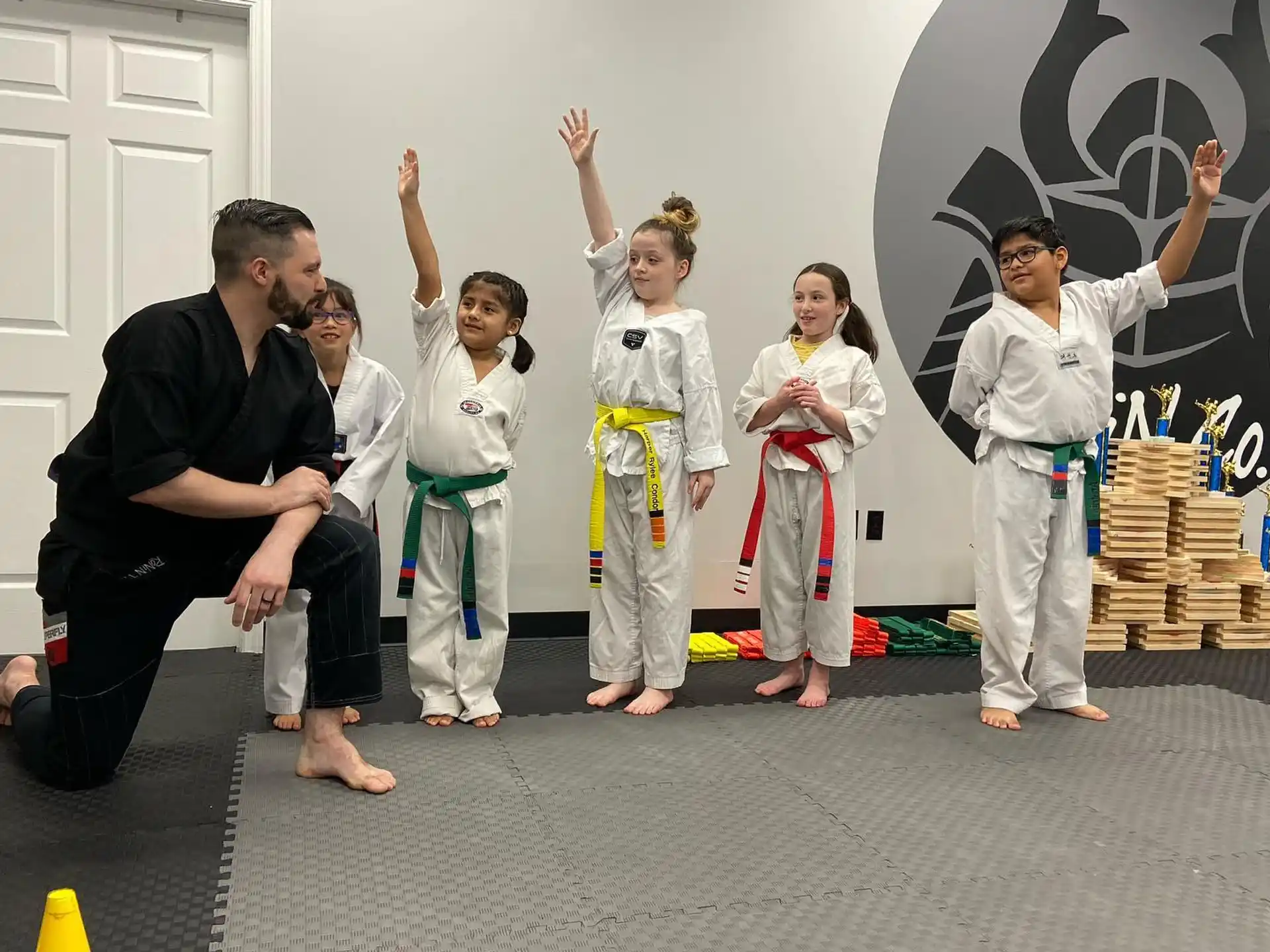 a group of people in karate uniforms