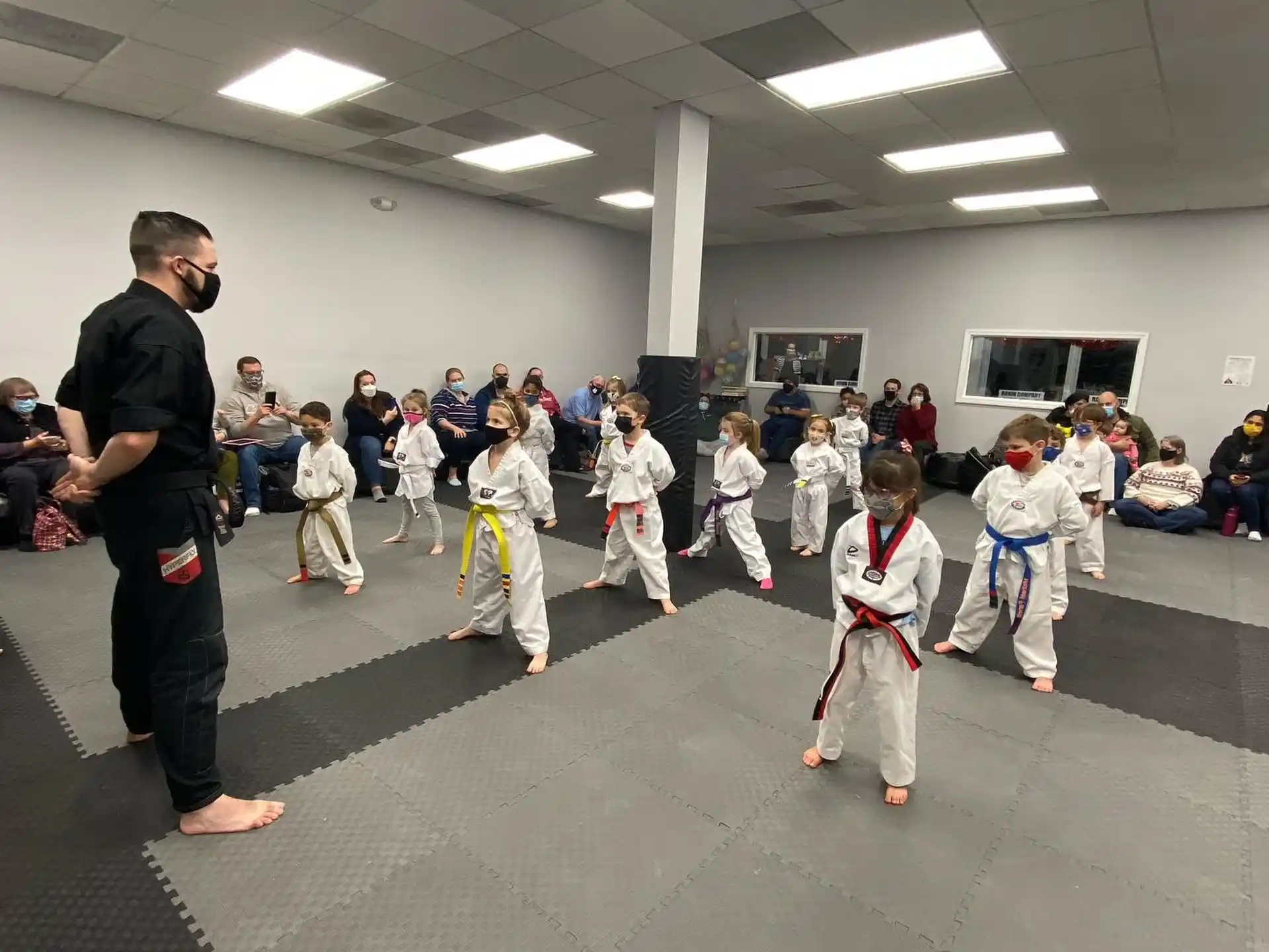 a person teaching children in a class