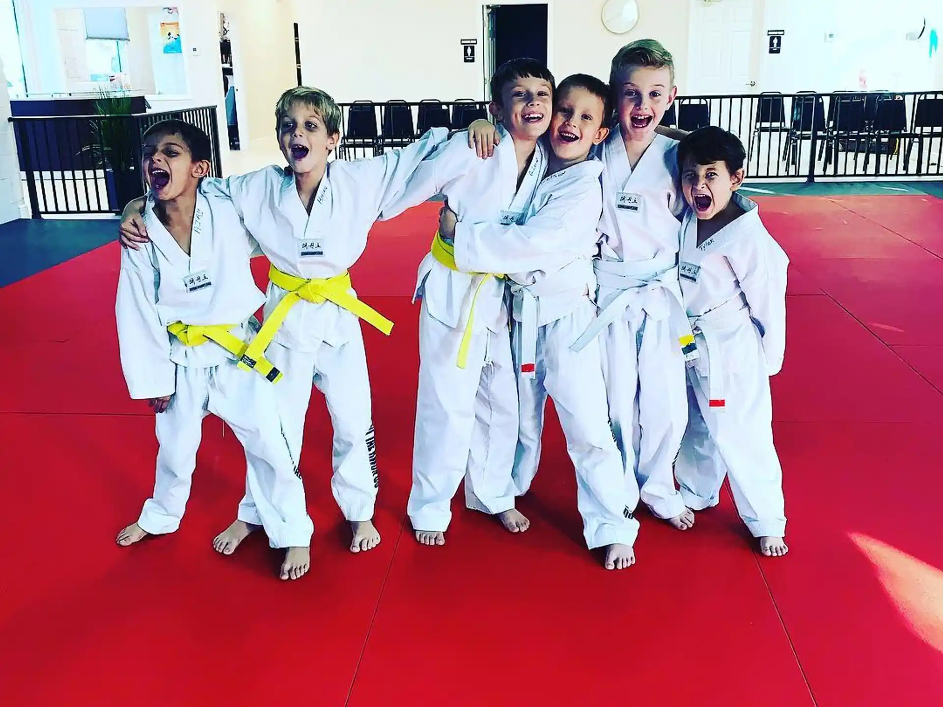 a group of people in karate uniforms