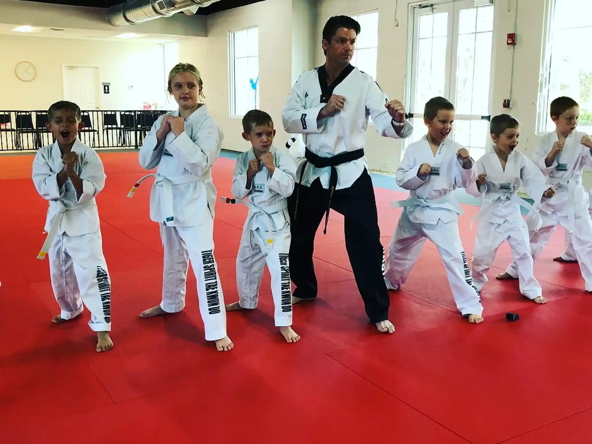 a group of people in karate uniforms
