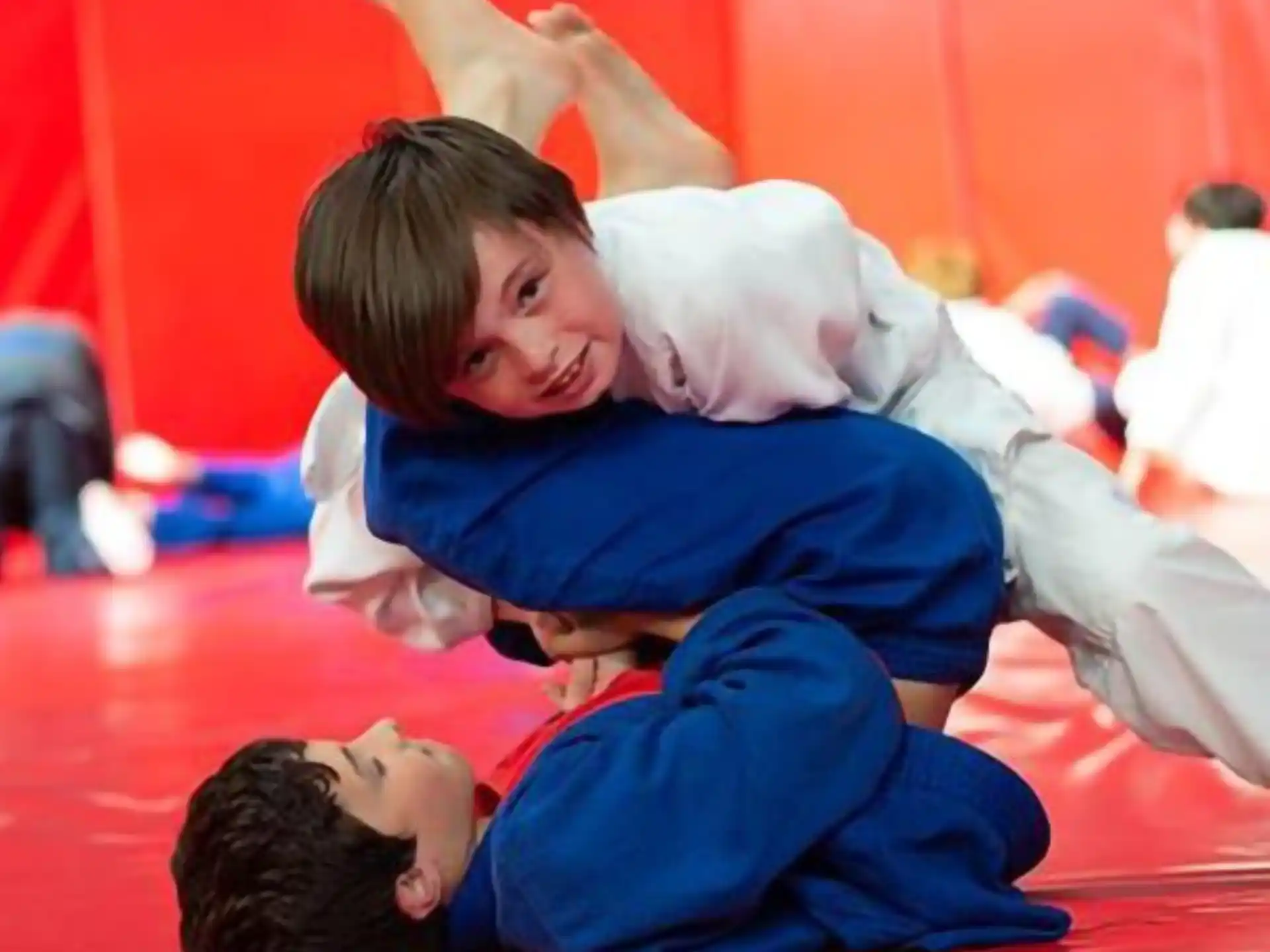 a boy and a girl lying on the floor