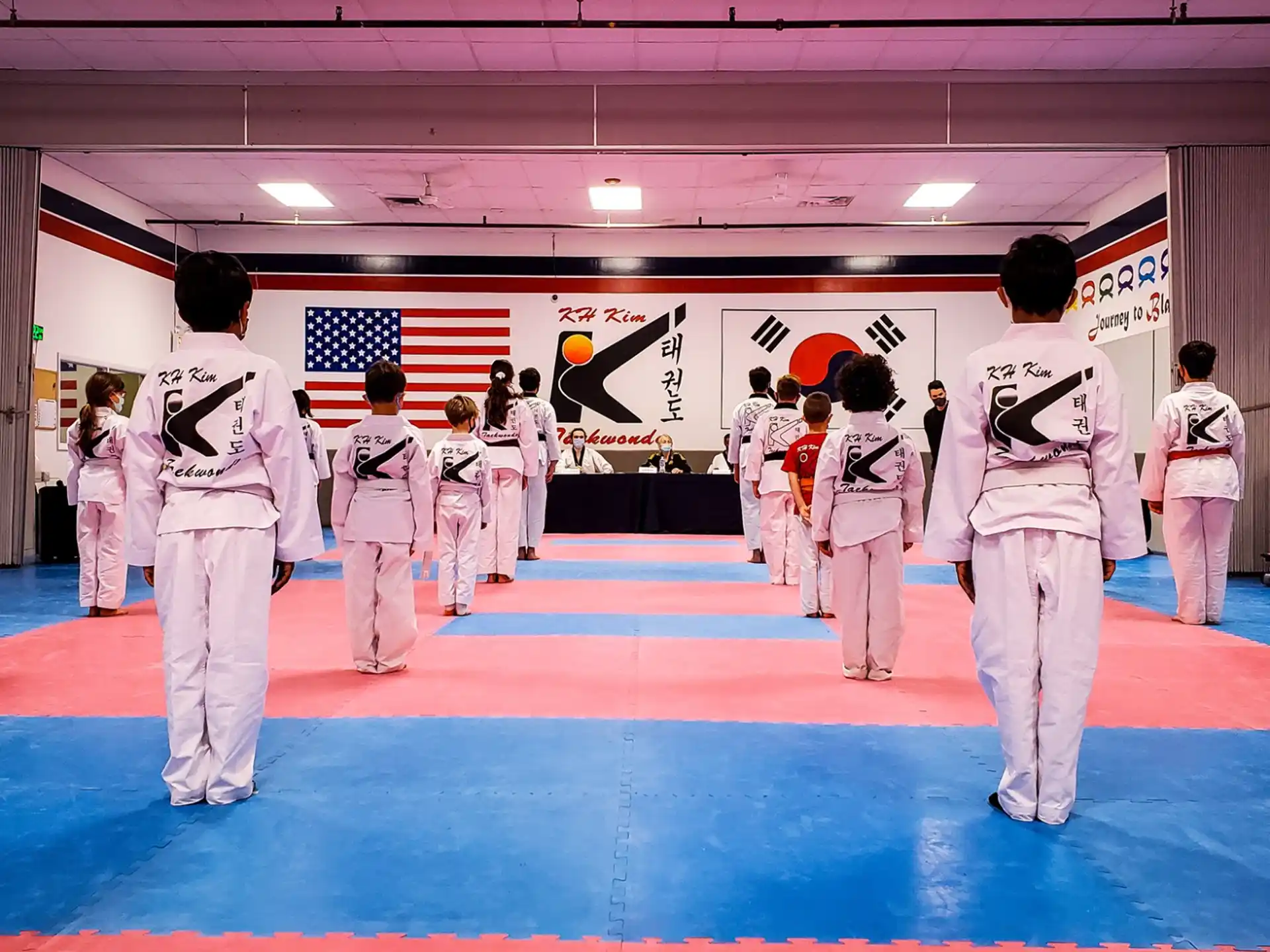 a group of people in karate uniforms