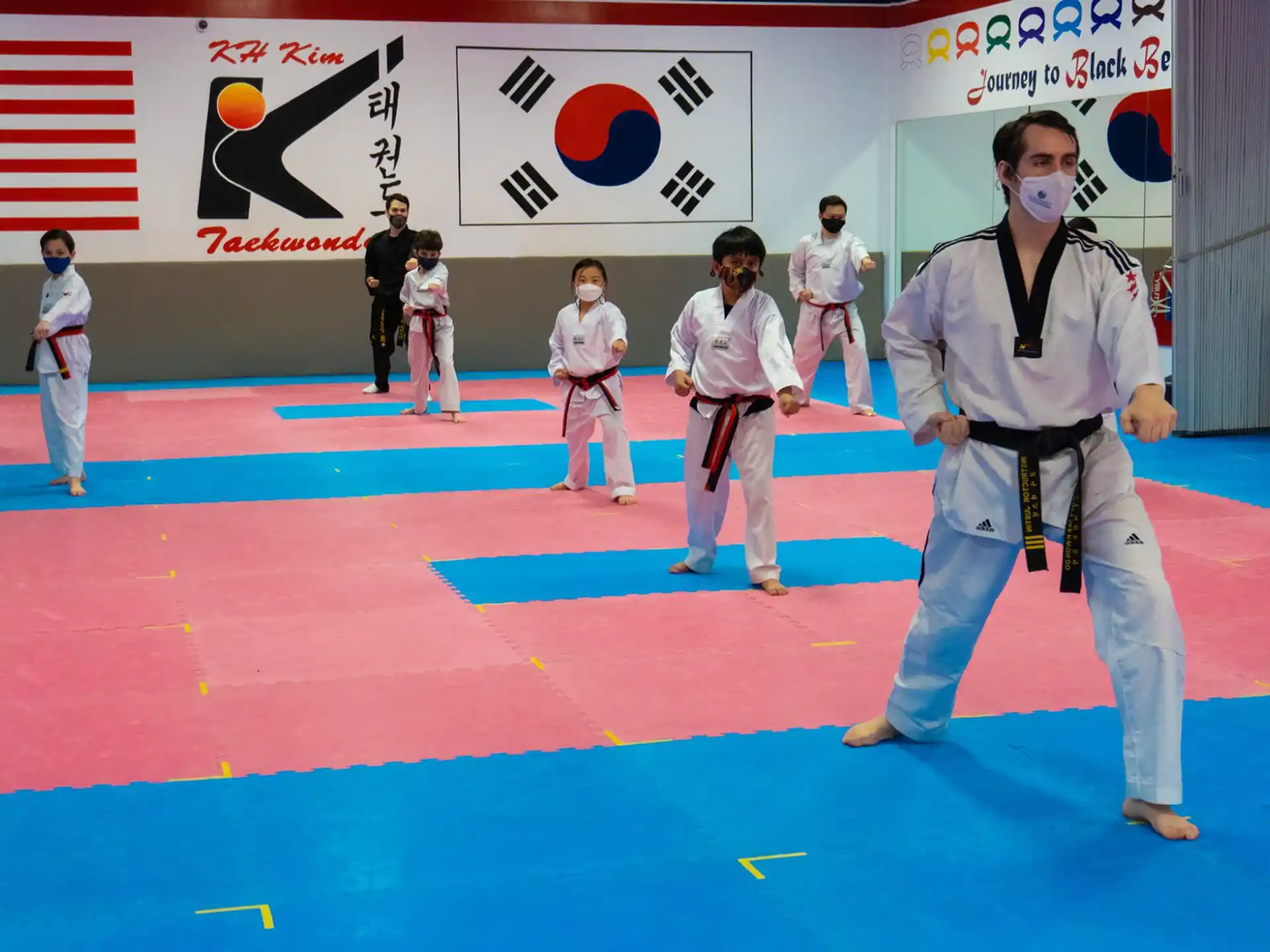 a group of people in karate uniforms