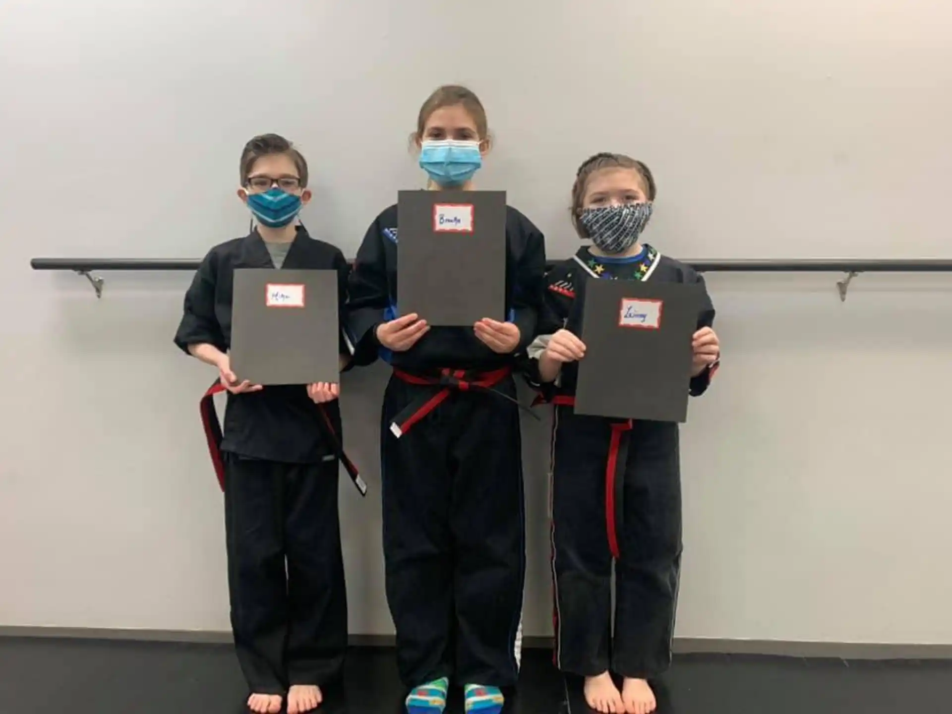 a group of kids wearing face masks