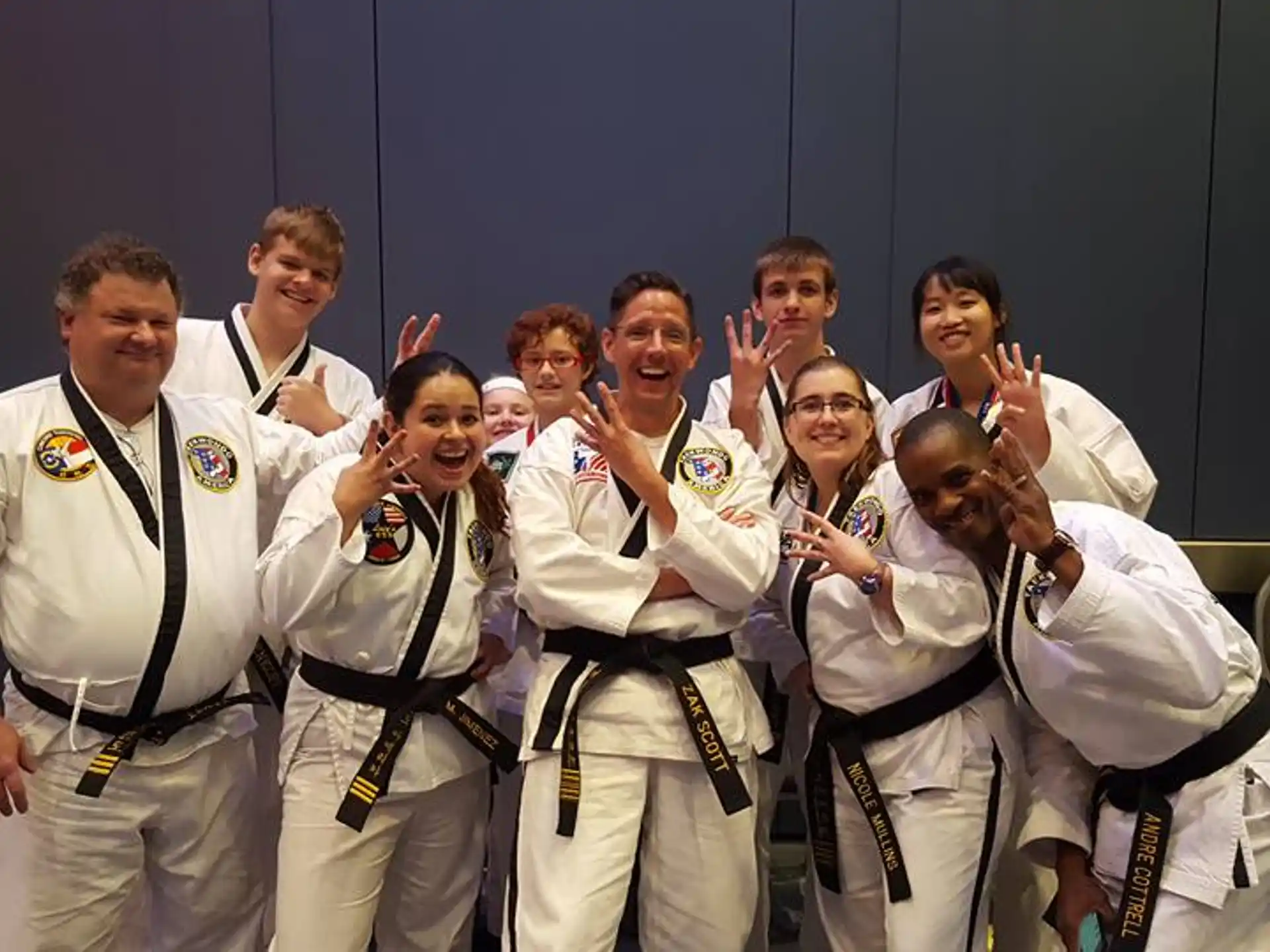 a group of people in karate uniforms