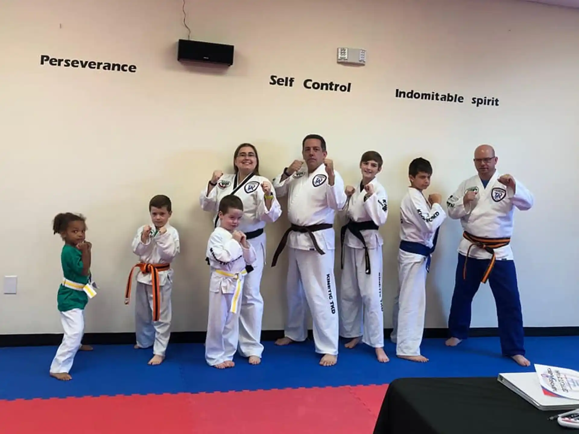 a group of people in karate uniforms