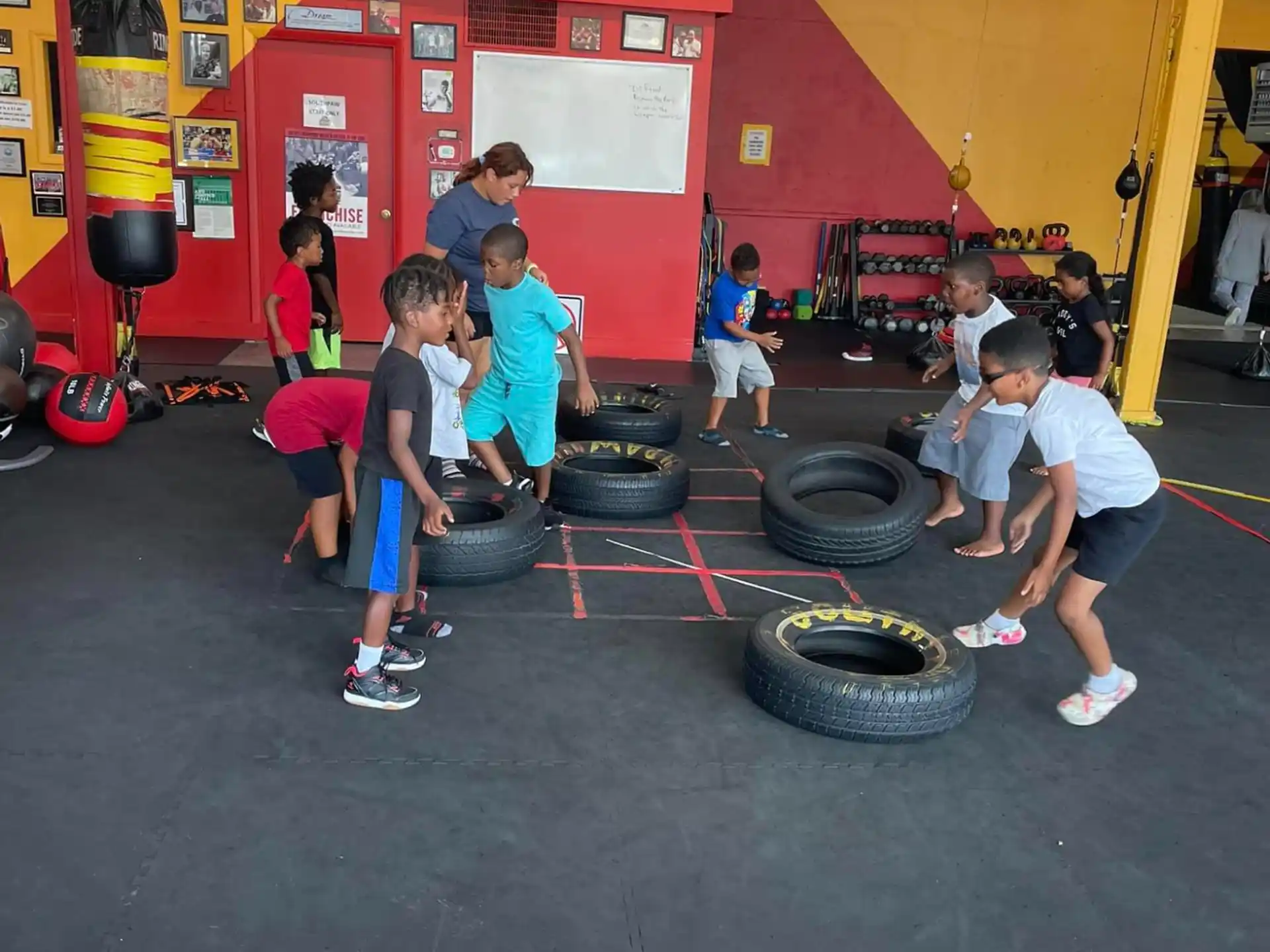 a group of kids playing on tires