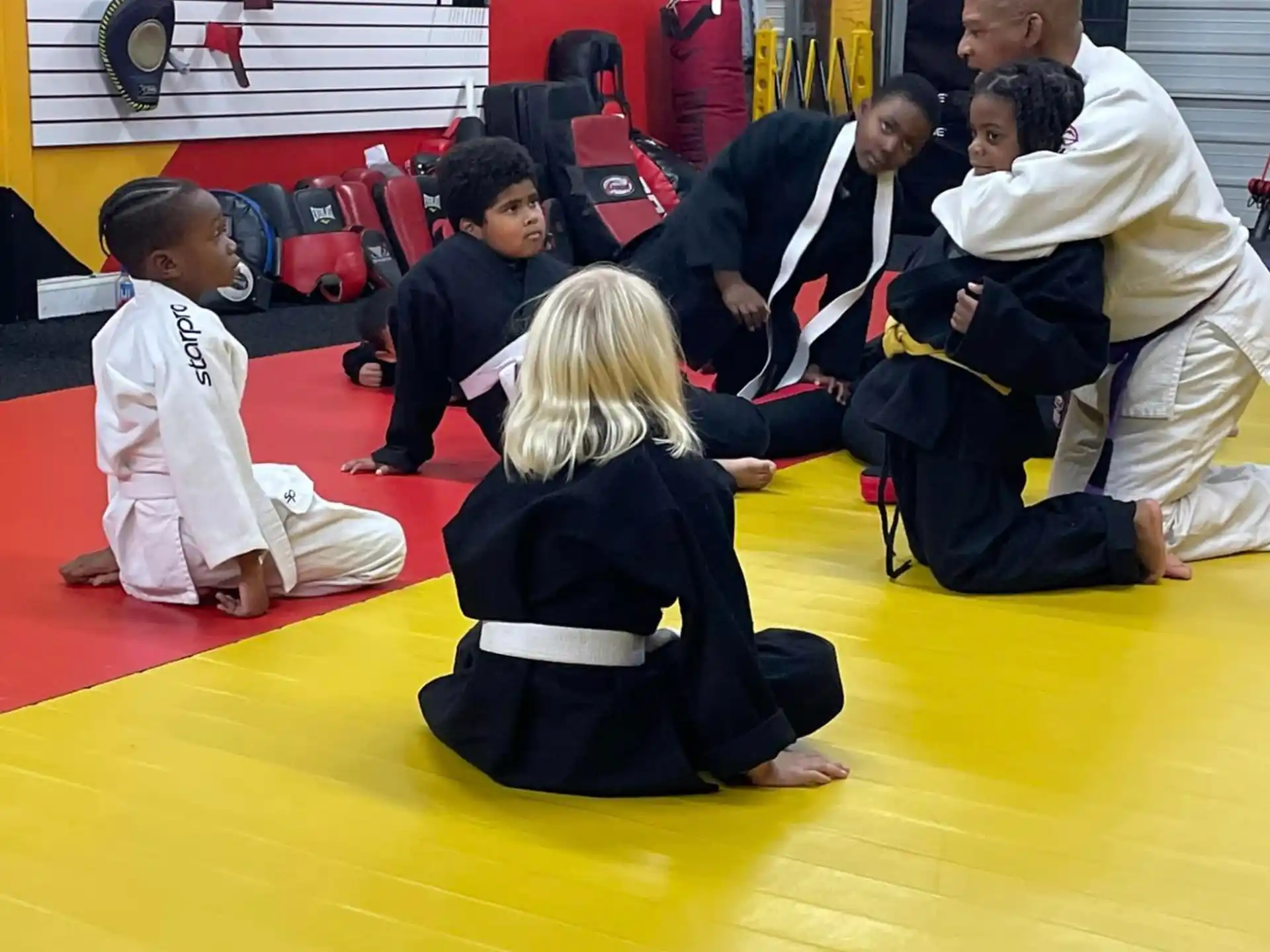 a group of people in karate uniforms