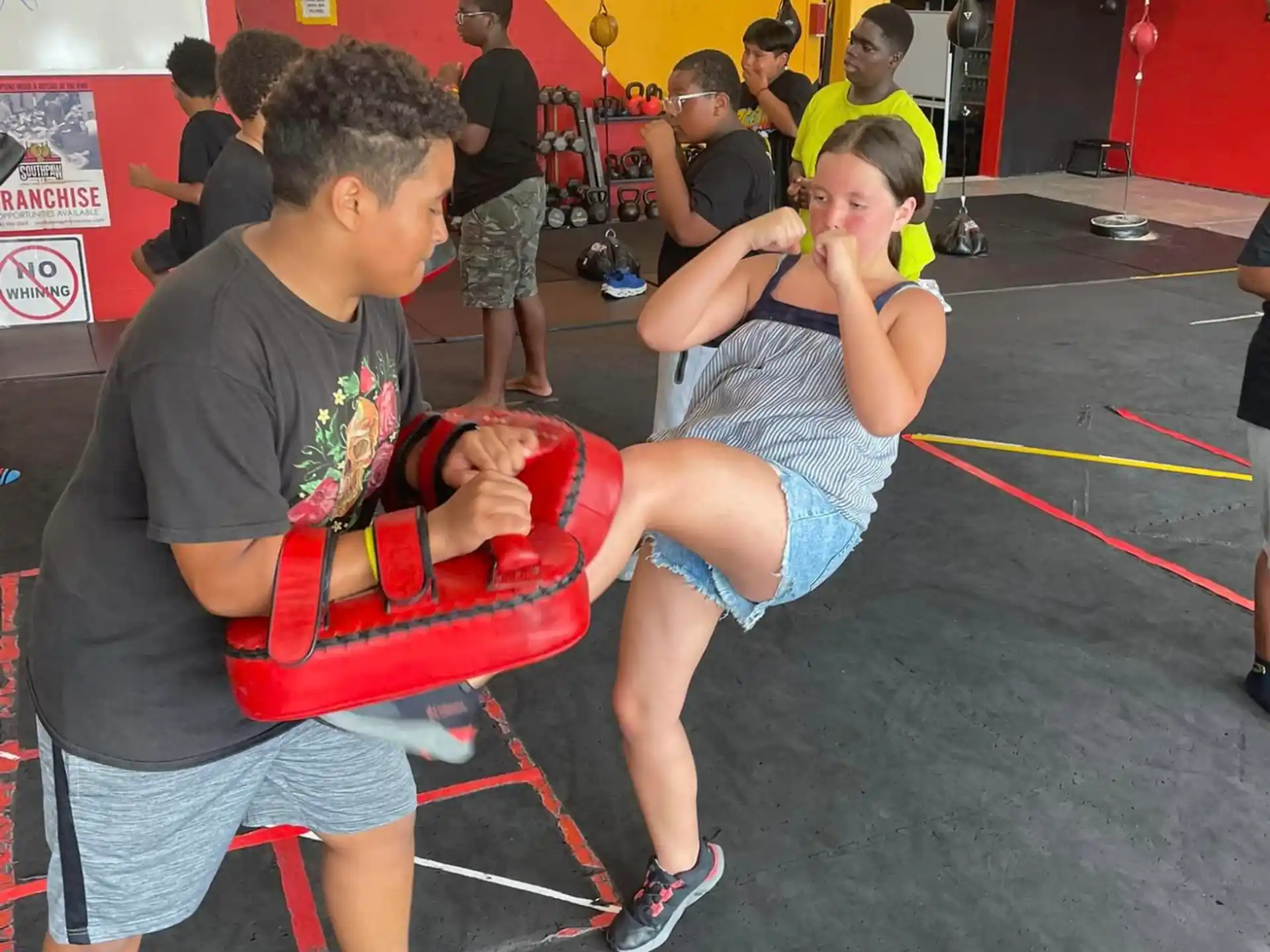 a man and a woman in a gym
